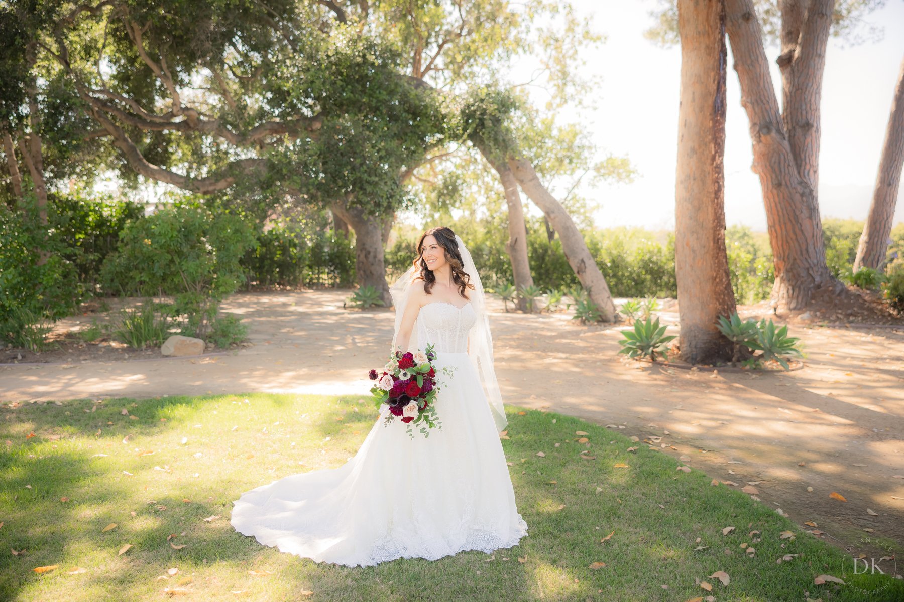 www.santabarbarawedding.com | Hidden Oaks Ranch | Bride Outside Among the Trees at the Wedding Venue