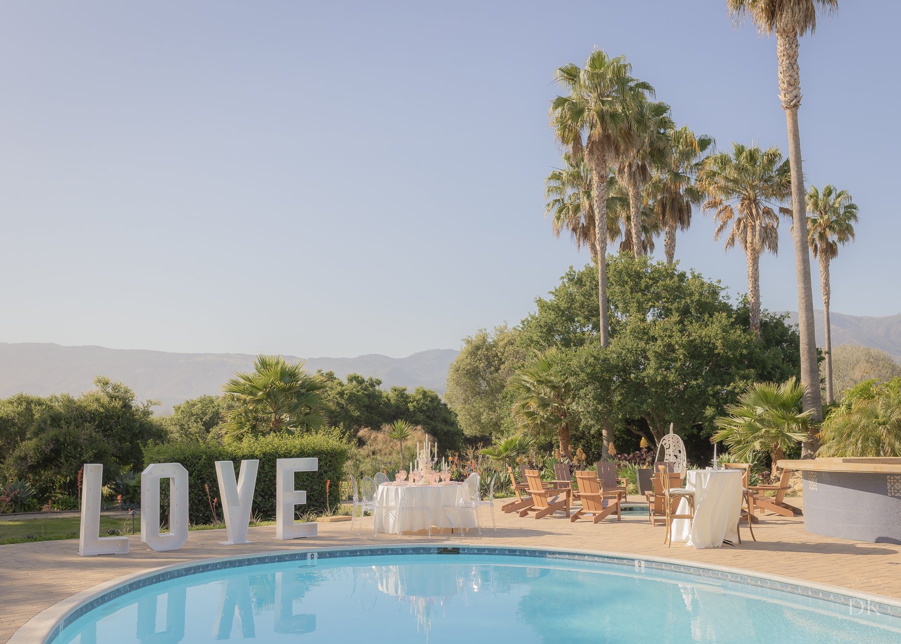 www.santabarbarawedding.com | Hidden Oaks Ranch | Love Sign and Set Up by the Pool at Wedding Venue
