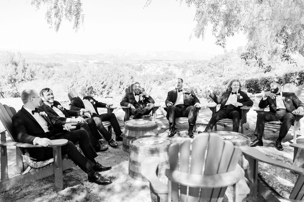 www.santabarbarawedding.com | Events by Fran | Kelsey Rinaldi | Spanish Hills Club | Casa Blanca Flowers | Friar Tux | Groom and Groomsmen Sitting in a Circle