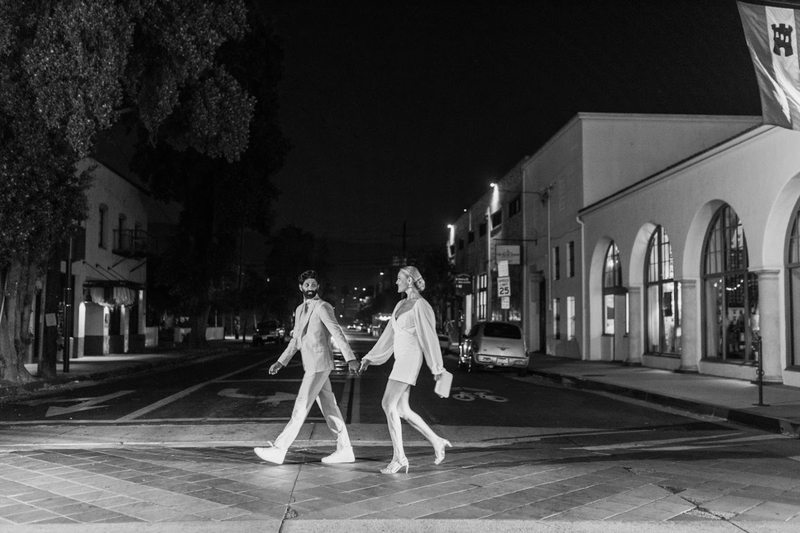 www.santabarbarawedding.com | White Sage | Loquita | David Mendoza | Ojala Floral | Couple Crossing the Street at Night