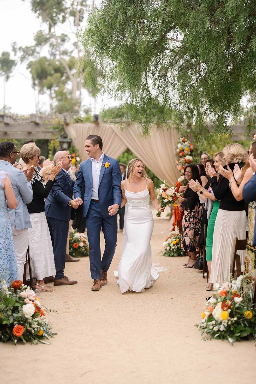 www.santabarbarawedding.com | Lina Bell | Ann Johnson Events | SB Historical Museum | The Poppy Pod | Blushing Beauty | Ventura Rentals | Lucky Devils Band | Couple Walking Out of Ceremony