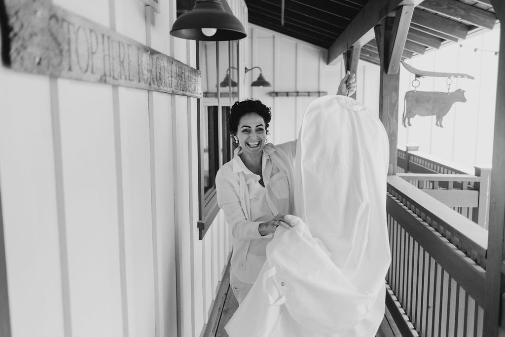 www.santabarbarawedding.com | Studio 7 Photography | Presqu’ile Winery | Alana Rae Events |  Rebel Floral | Dreamcatcher Artistry | Oscar de la Renta | Bride Carrying Wedding Dress