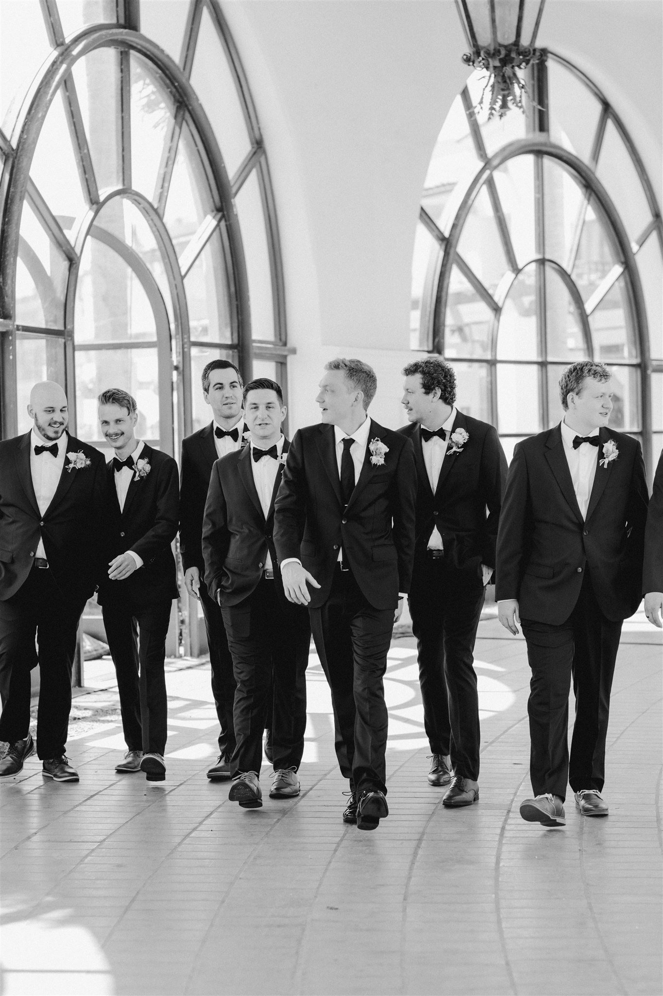 www.santabarbarawedding.com | Hilton Beachfront Resort | LuckEleven Events | Brocoff Photography | Once Upon A Florist | Groom Walking with Groomsmen