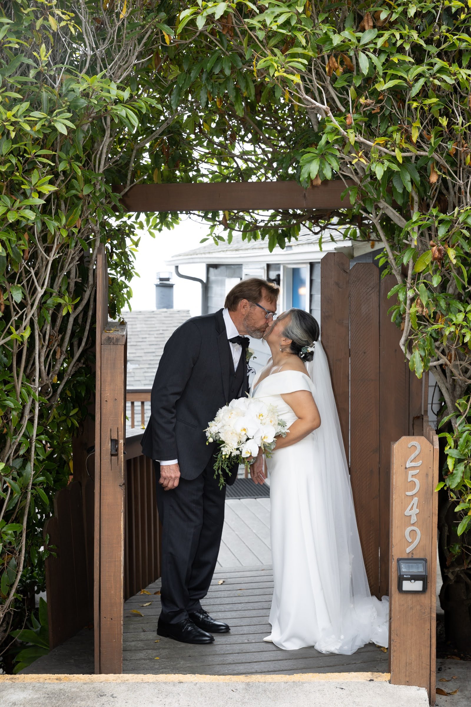 www.santabarbarawedding.com | Emily Hart-Roberts | Carr Winery | Felici Events | Ella &amp; Louie | Rogue Styling | Bride and Groom Kiss Outside