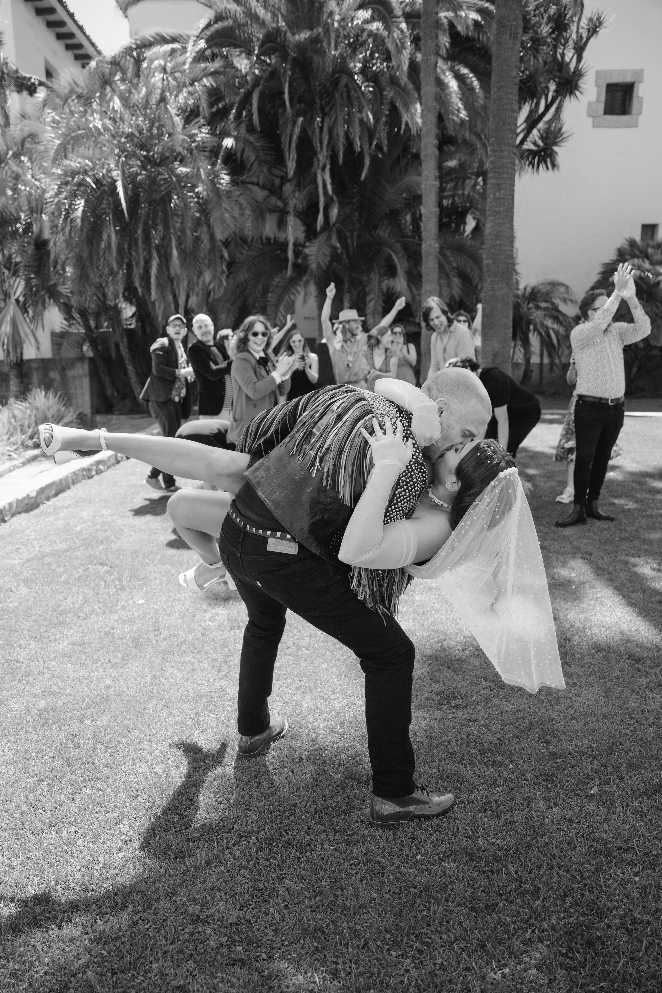 www.santabarbarawedding.com | Santa Barbara Courthouse | The Bomani’s | Bride and Groom Kissing On Courthouse Lawn