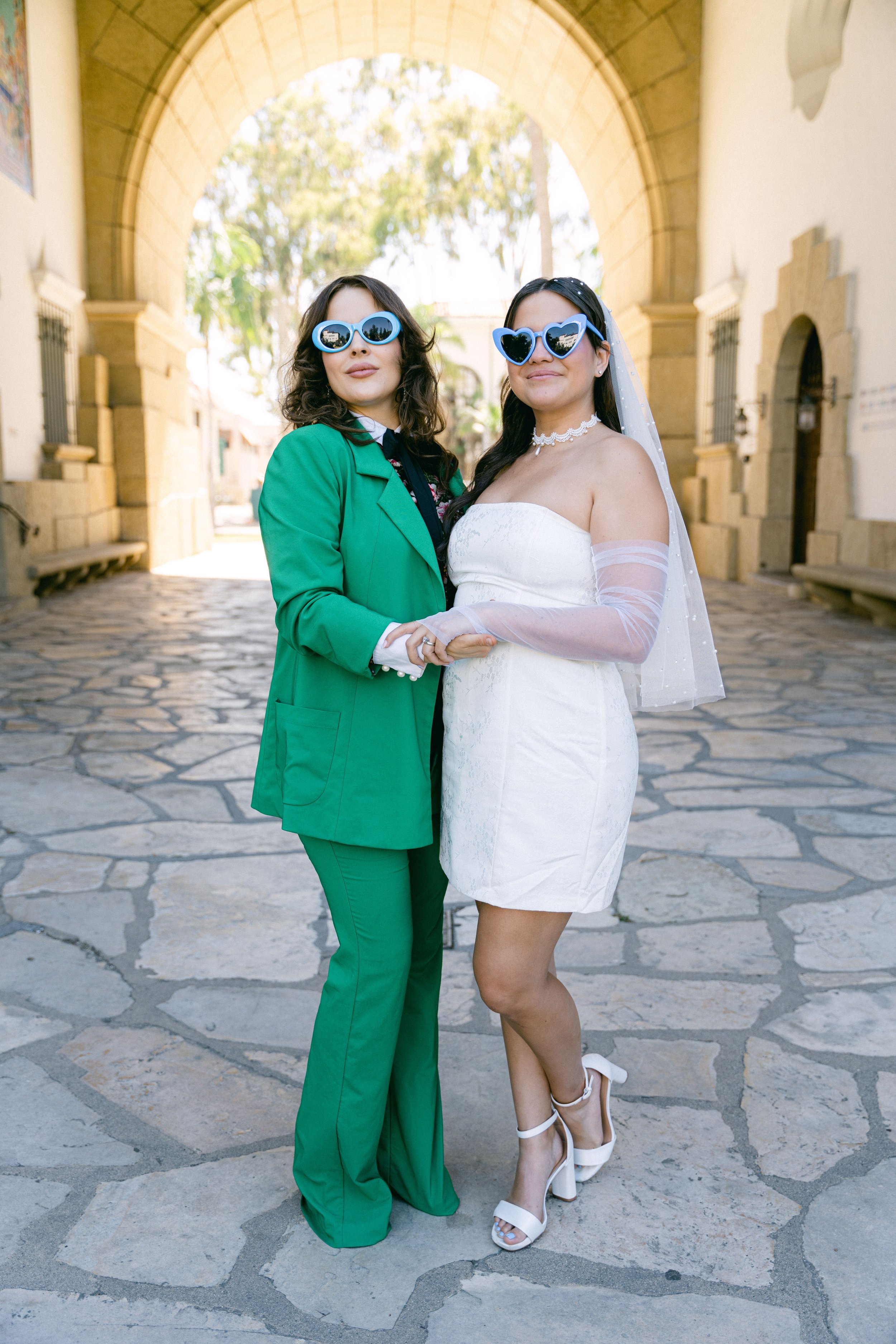 www.santabarbarawedding.com | Santa Barbara Courthouse | The Bomani’s | Bride and Guest in Green Suit