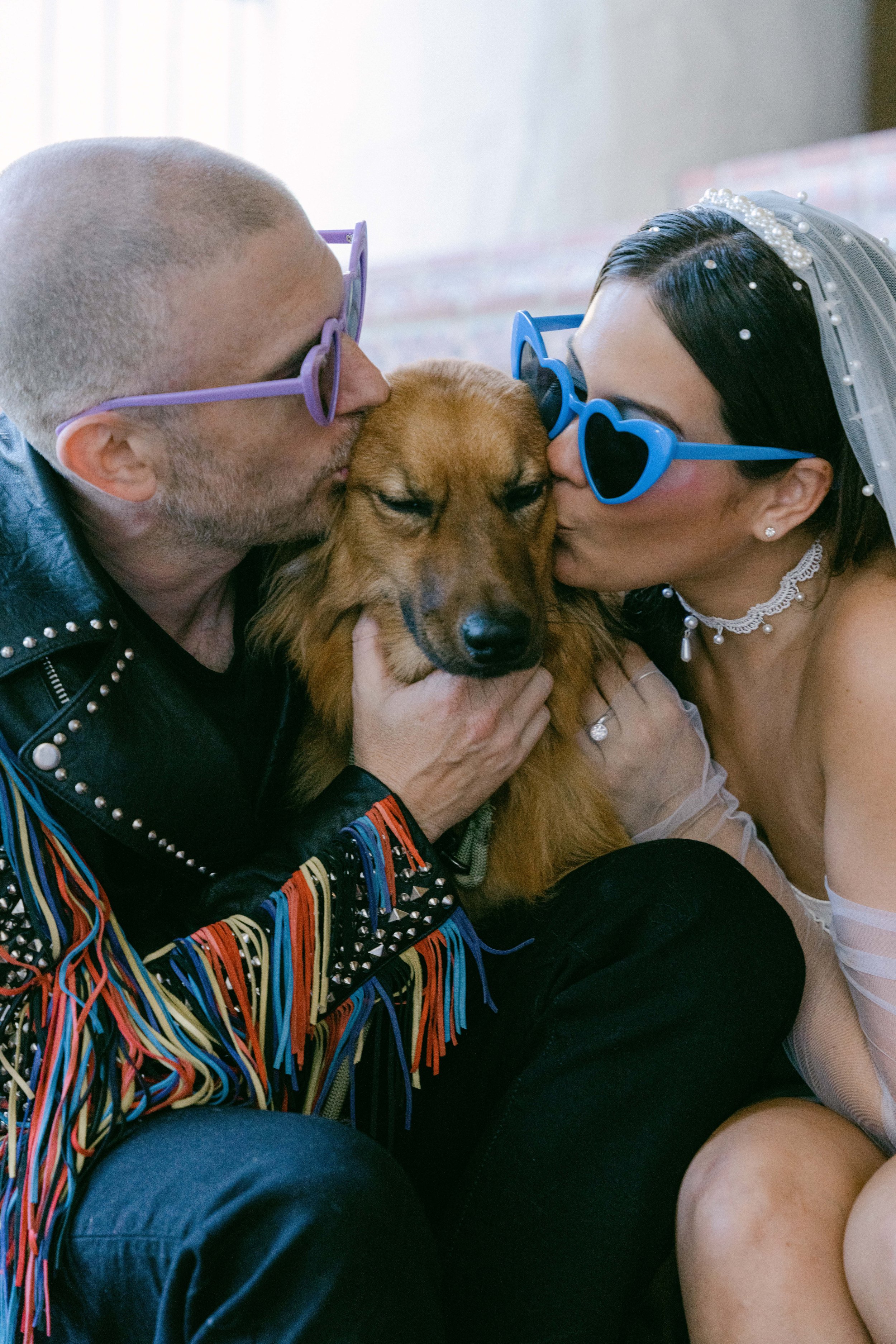 www.santabarbarawedding.com | Santa Barbara Courthouse | The Bomani’s | Bride and Groom Kissing Their Dog