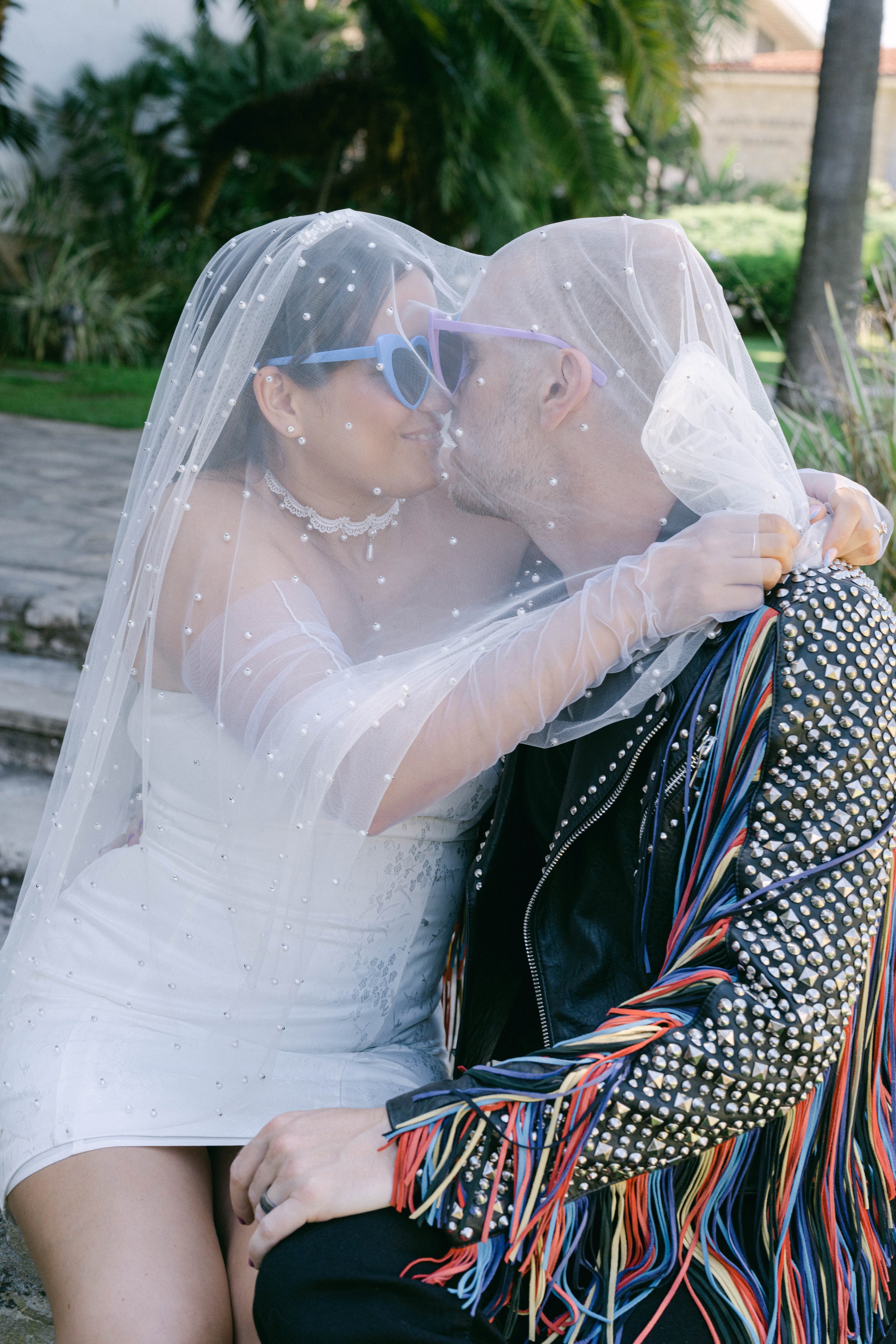 www.santabarbarawedding.com | Santa Barbara Courthouse | The Bomani’s | Bride and Groom Kissing Under Bride's Veil