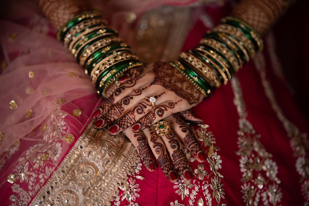 www.santabarbarawedding.com | Gatherings for Good | Hilton Beachfront | Peter Nguyen Studio | Whitney Destiny Beauty | Close Up of Bride’s Hands with Bracelets and Henna Tattoos