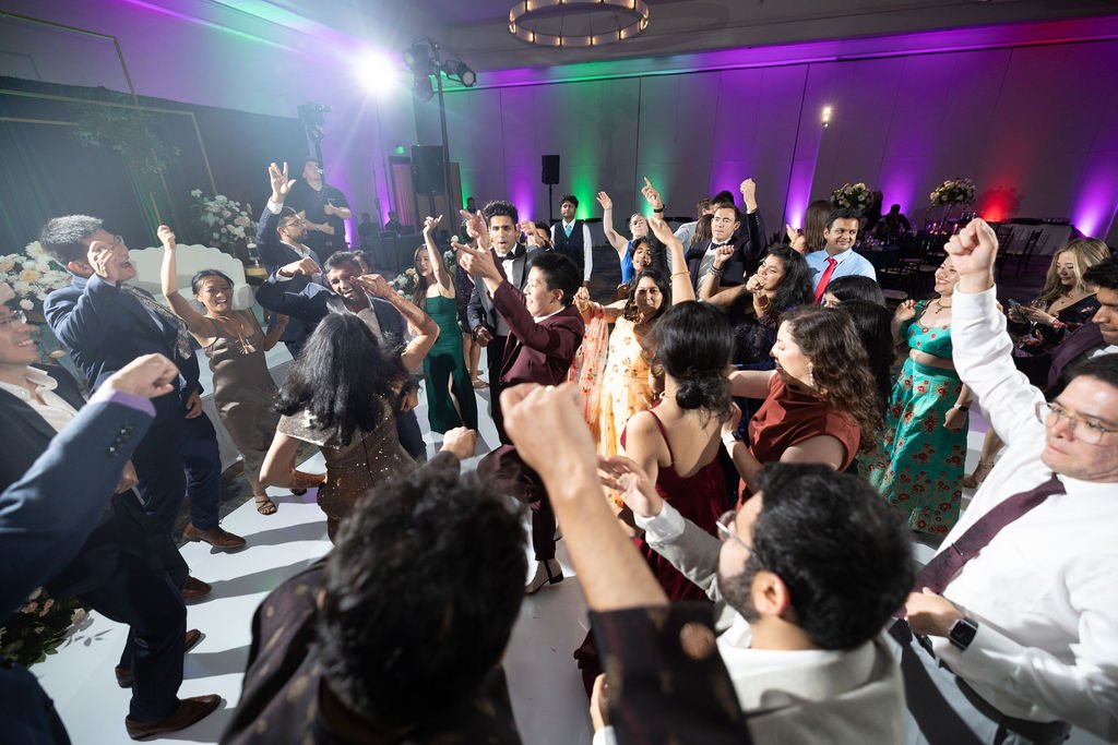 www.santabarbarawedding.com | Gatherings for Good | Hilton Beachfront | Peter Nguyen Studio | Bright Event Rentals | Sound Nation LA | Couple and Guests Dancing at Reception