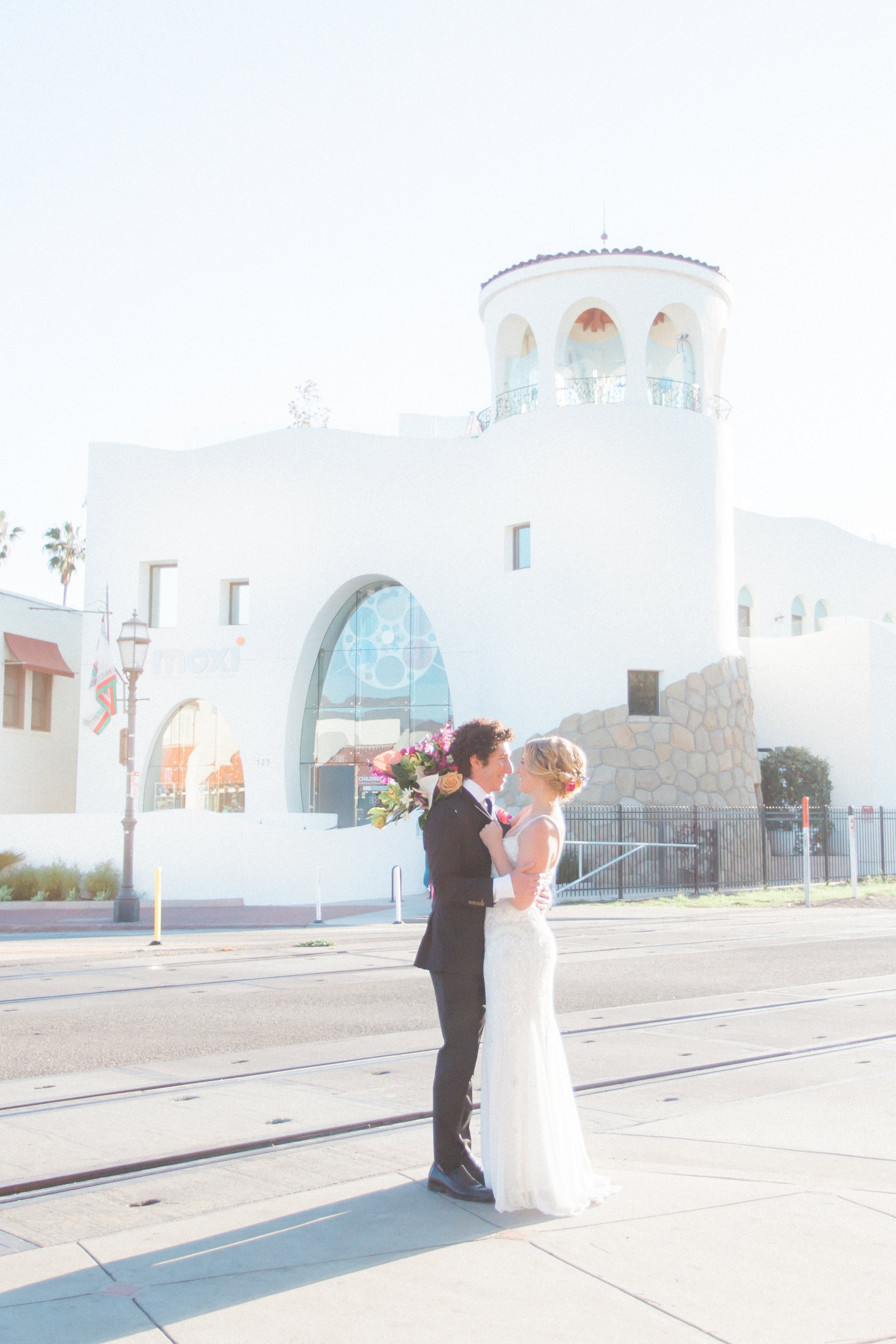 www.santabarbarawedding.com | MOXI Museum | James + Jess Photography | Couple Embracing in Front of the Museum