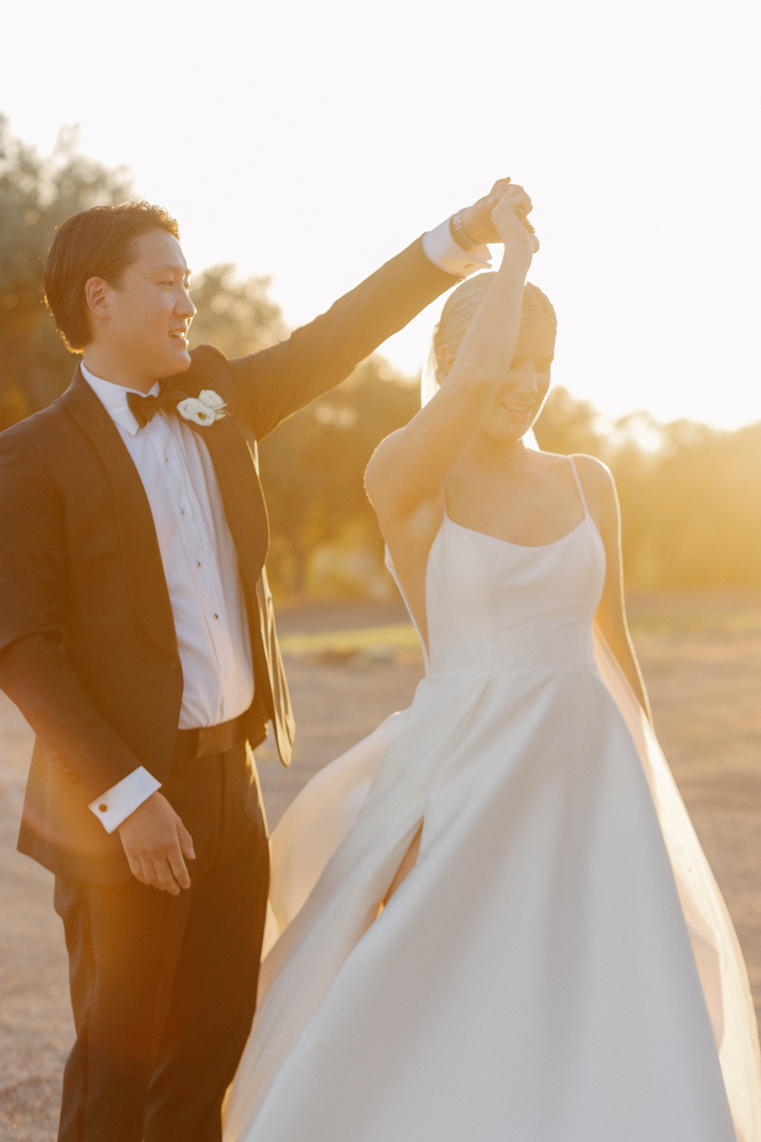 www.santabarbarawedding.com | Tonya Szele | Haley Garces | Tuscan Hills | Ella &amp; Louie | Carlyle Salon | Bride and Groom Twirling at Sunset