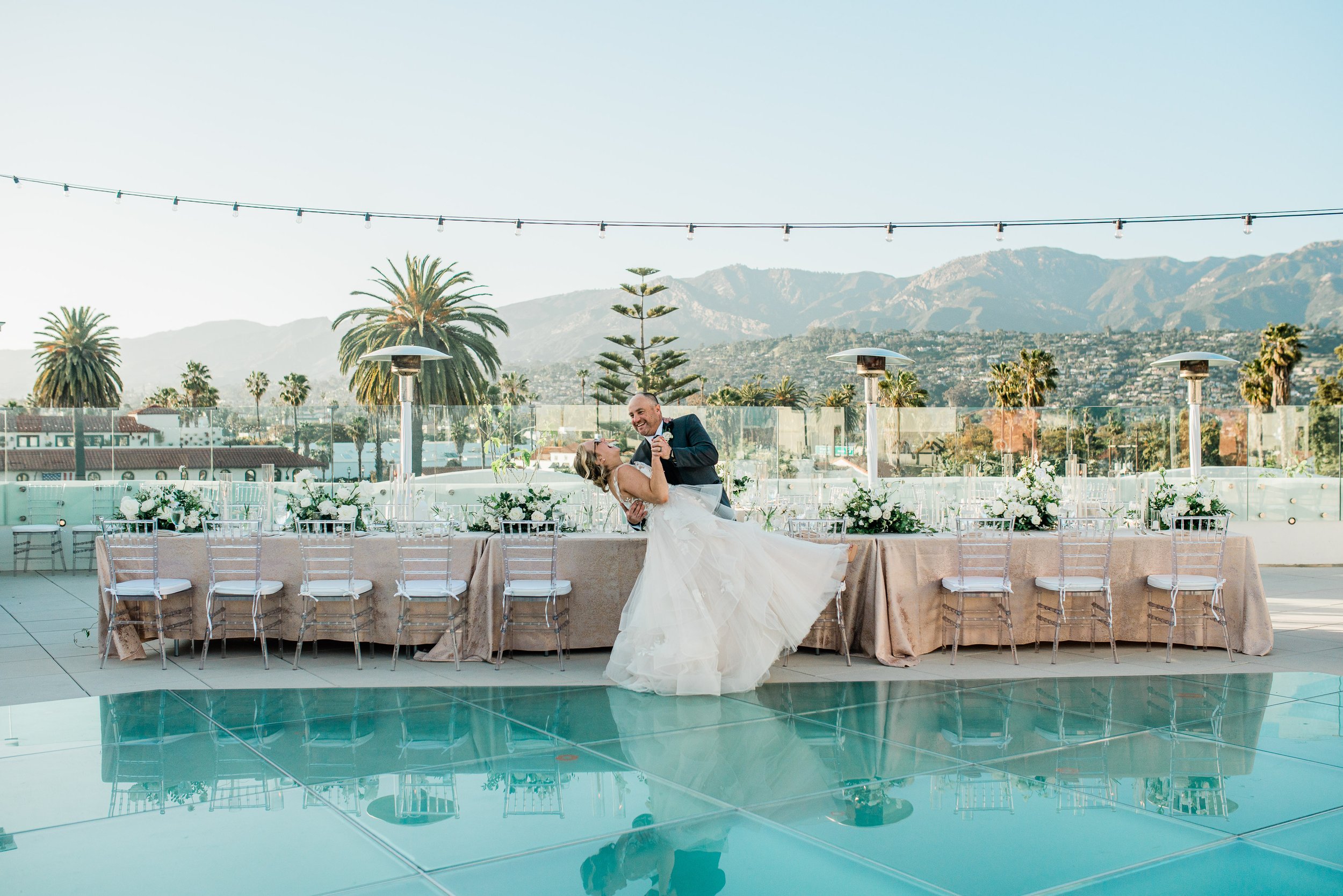 www.santabarbarawedding.com | Leana Myra | The MOXI | Drake Social | Blooms of Santa Barbara | The Tent Merchant | BBJ La Tavola | Bright Event Rentals | Couple in Front of Reception Table
