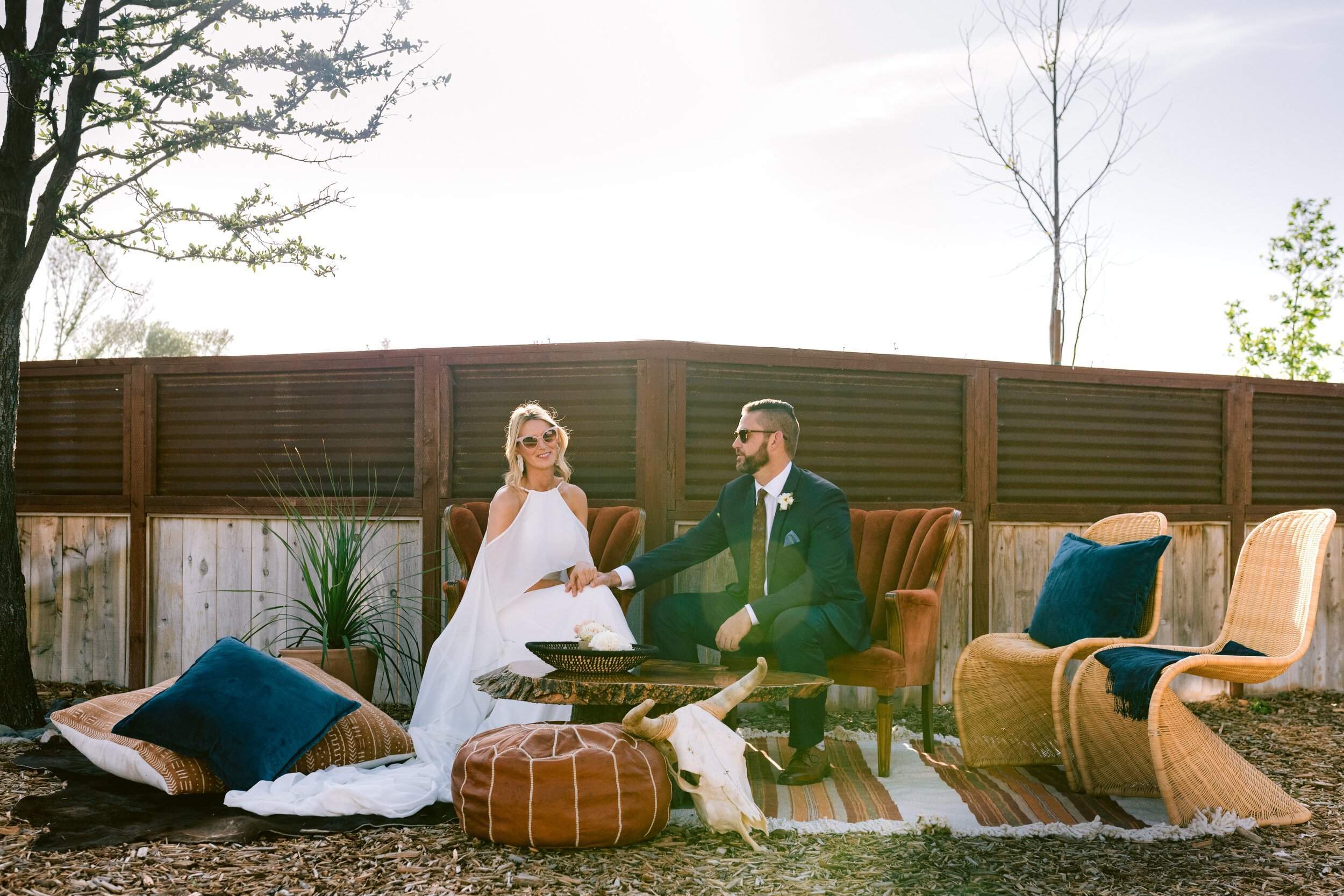 www.santabarbarawedding.com | Flying Flags RV Resort | Mollie Crutcher Photography | Bride and Groom Sitting on Lounge Area