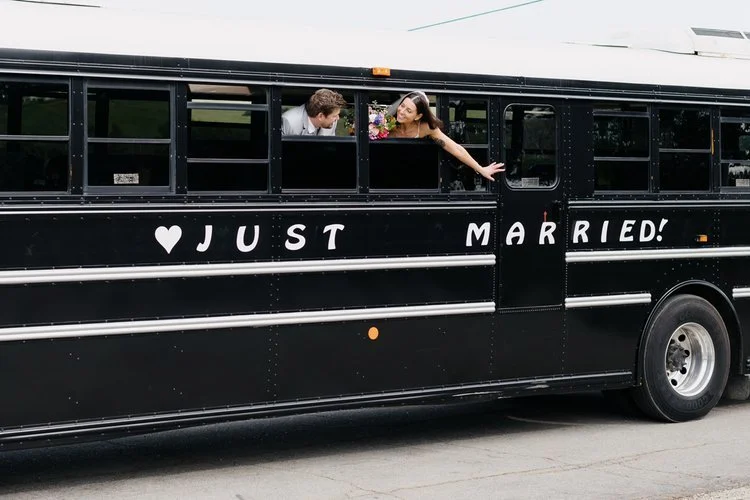 www.santabarbarawedding.com | Jump on the School Bus | Couple Posing Outside of School Bus Window