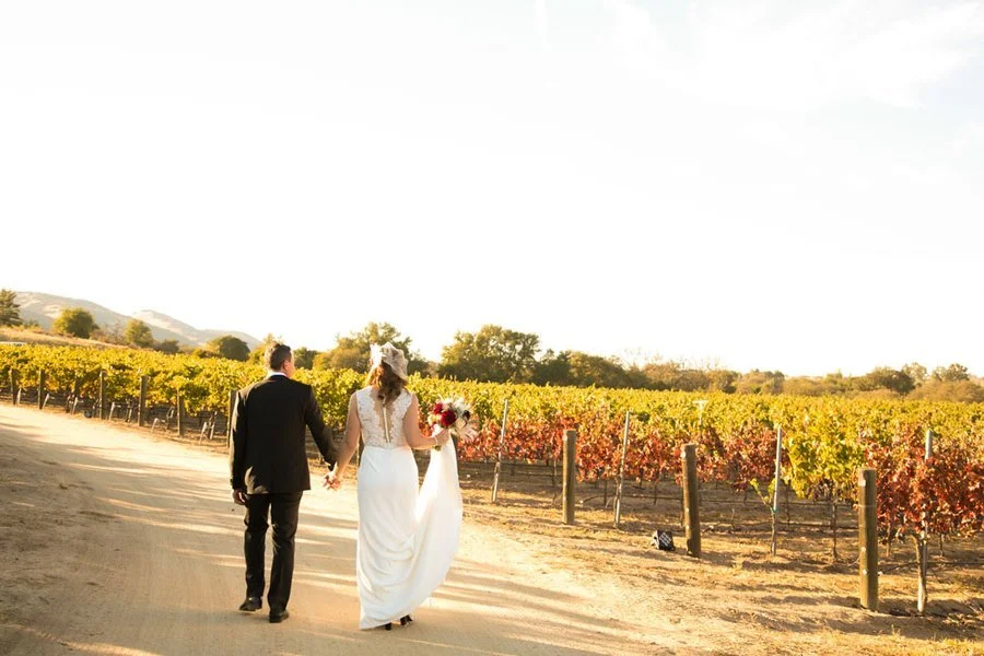 www.santabarbarawedding.com | A. Blake Photography | Couple Walking Holding Hands at Santa Barbara Winery Wedding