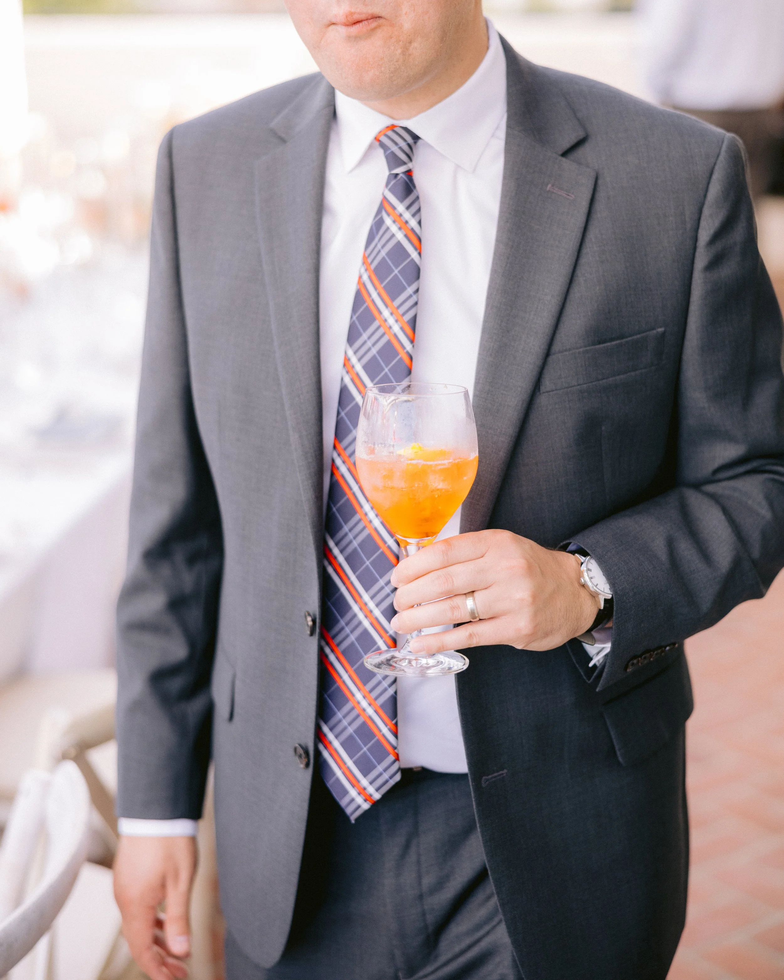 www.santabarbarawedding.com | Kyle London Photography | Belmond El Encanto | Gatherings for Good | Blooms of Santa Barbara | The Tent Merchant | Guest Holding Cocktail