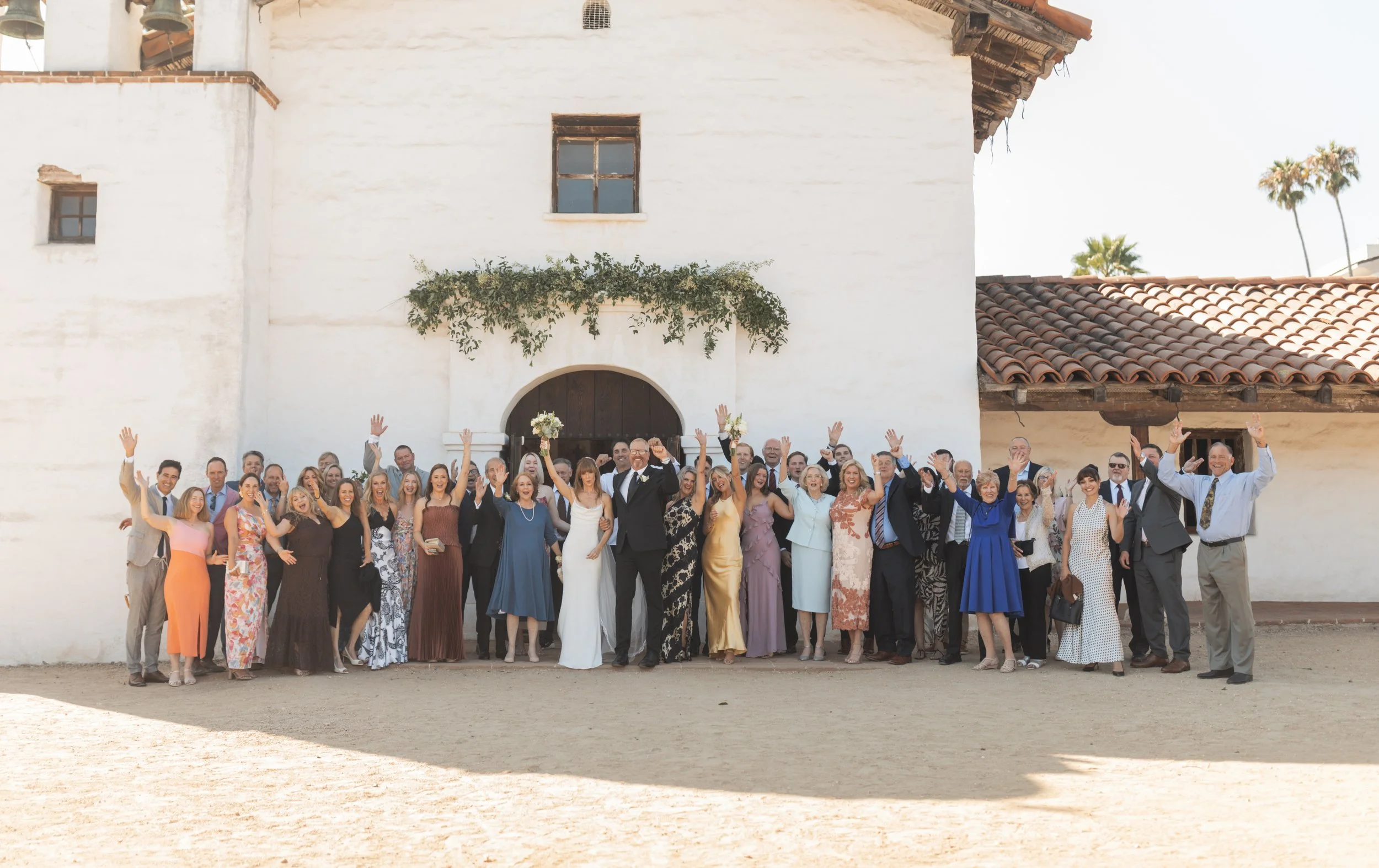 www.santabarbarawedding.com | Lauren Maeve | Presidio Chapel | Coastal Rose Events | The Twisted Twig | Marla &amp; Co. | Couple and Guests After Ceremony