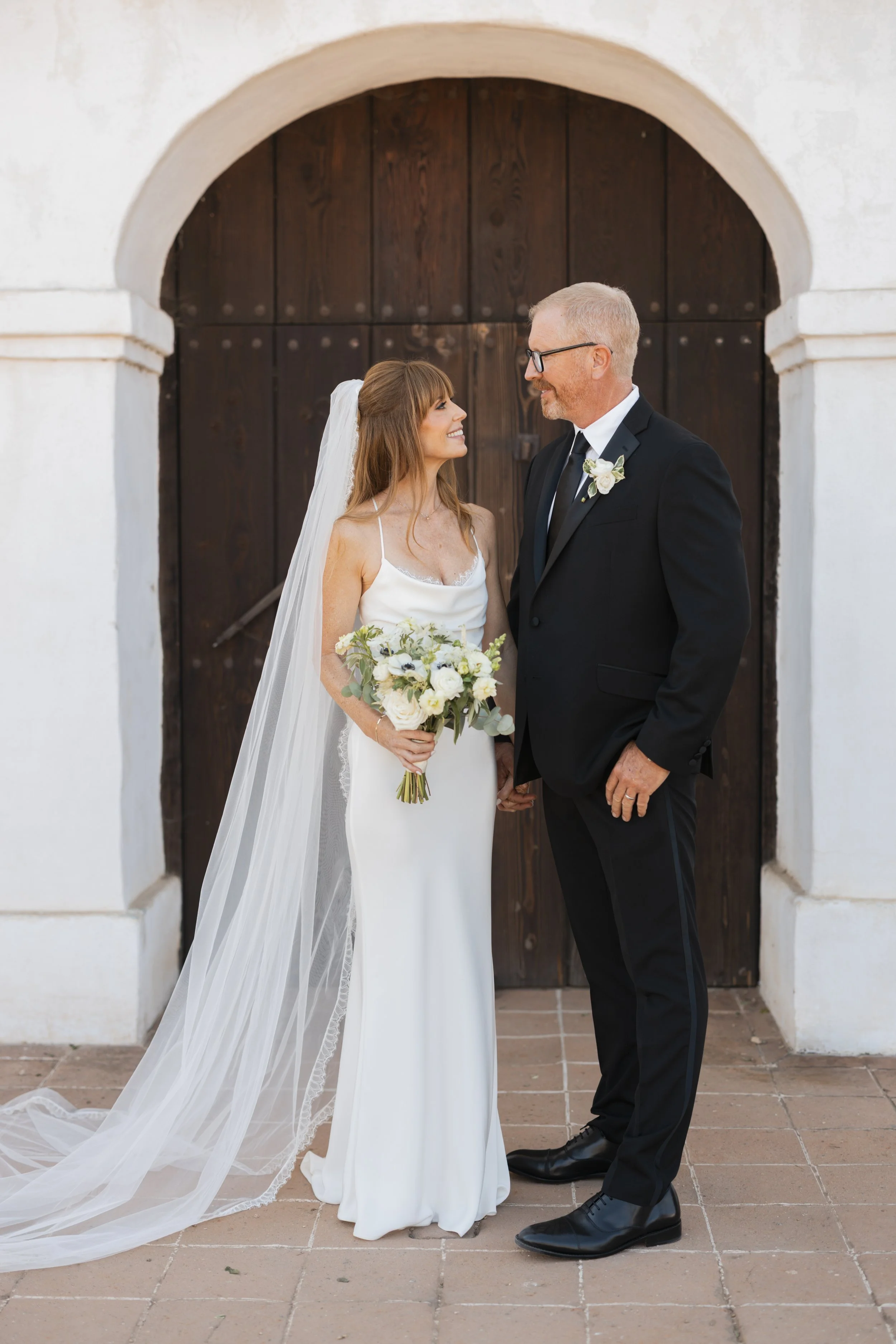 www.santabarbarawedding.com | Lauren Maeve | Presidio Chapel | Coastal Rose Events | The Twisted Twig | Marla &amp; Co. | Couple After Ceremony