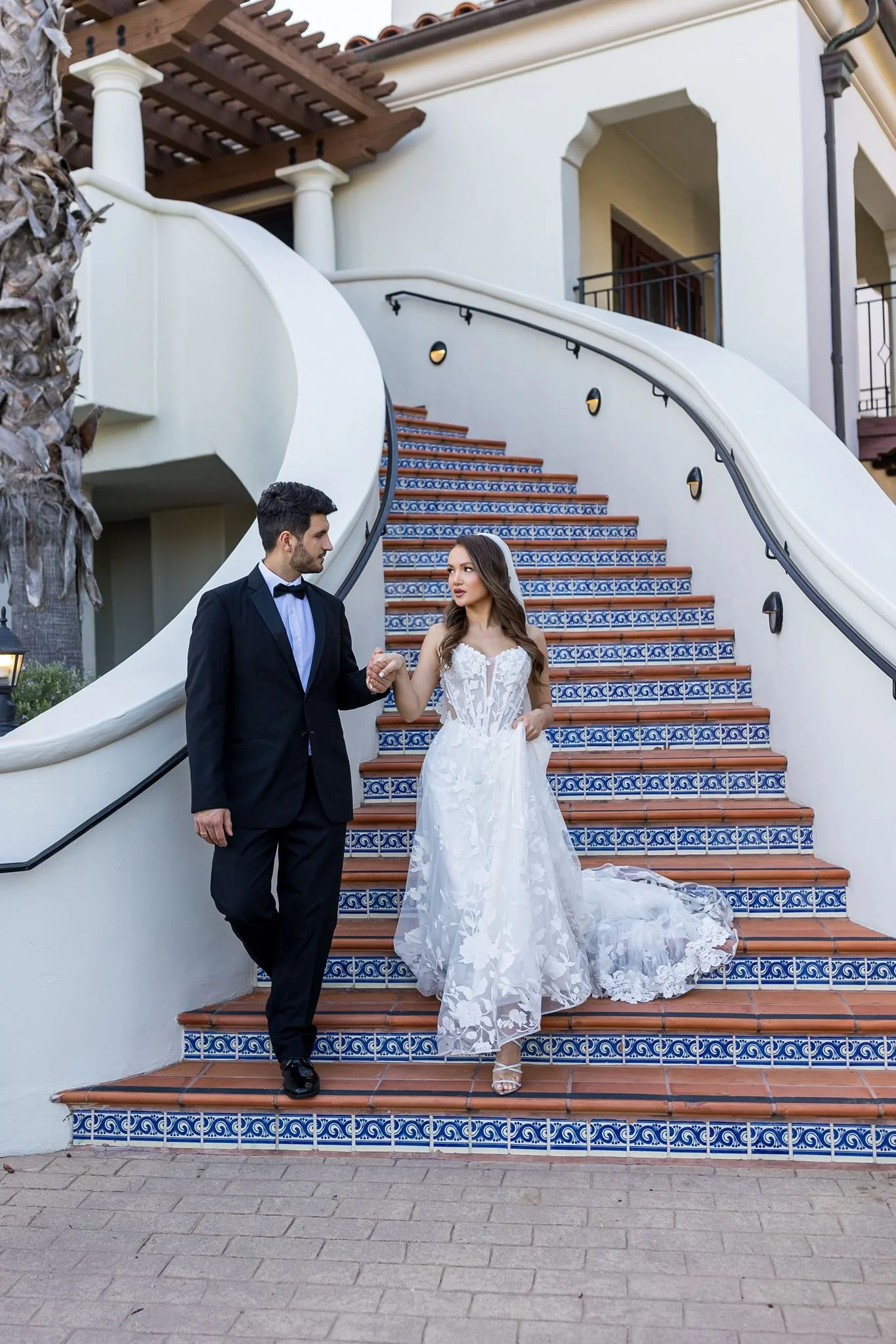 www.santabarbarawedding.com | Elizabeth Victoria | Ritz-Carlton Bacara | AK Brides | Alpha Floral | Pacheco Beauty | Mission Tuxedos | Groom in Tux | The Dress Bride | Couple Walking Down Stairs