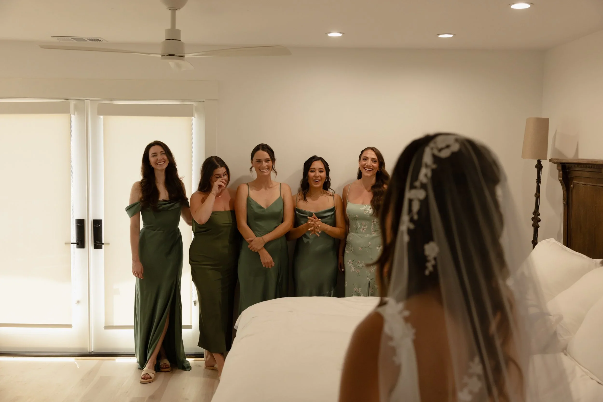 Bride reveal photo with bridesmaids