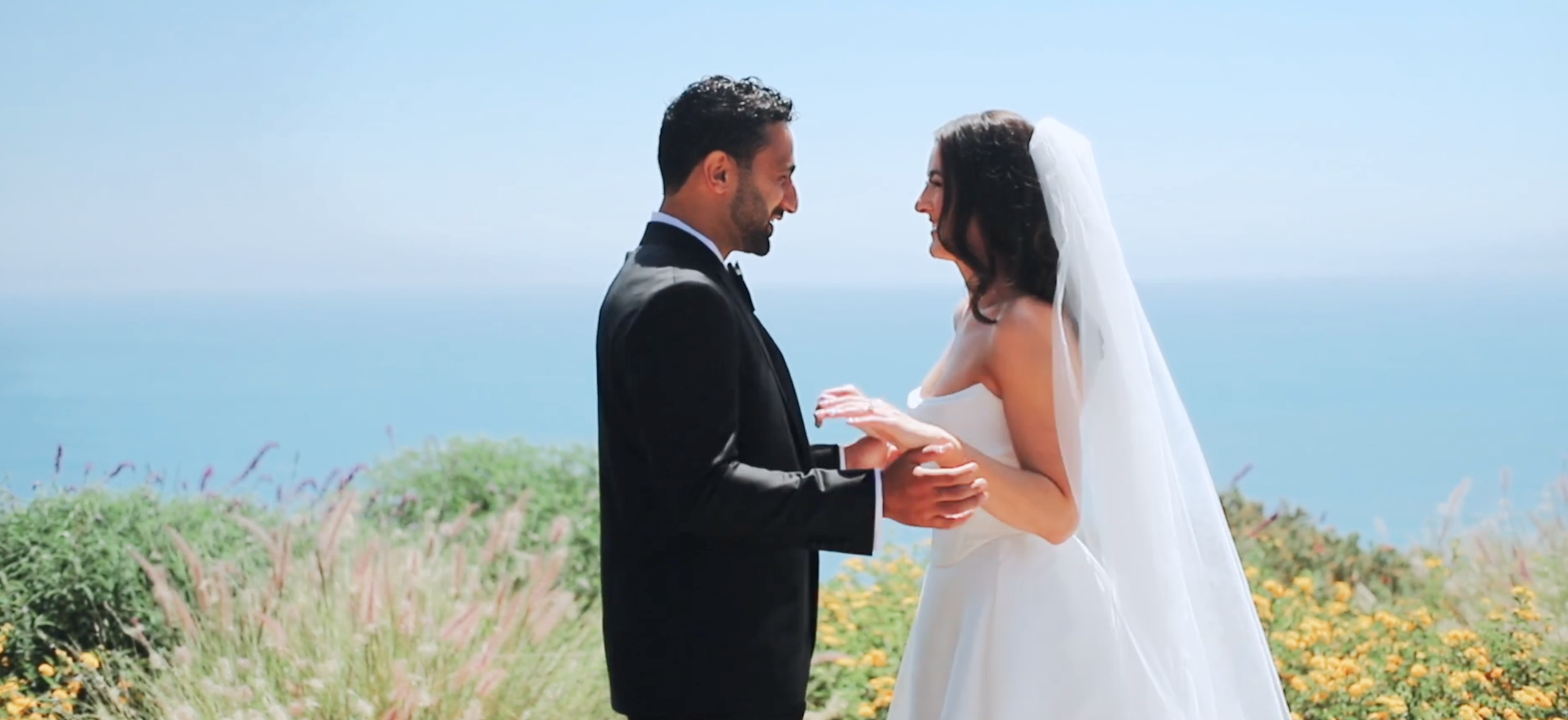 Couple first look with ocean in background
