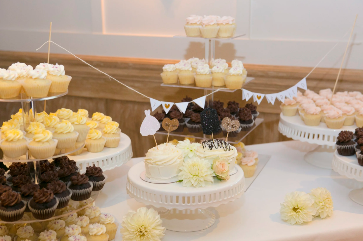 Dessert table with cupcakes at wedding reception