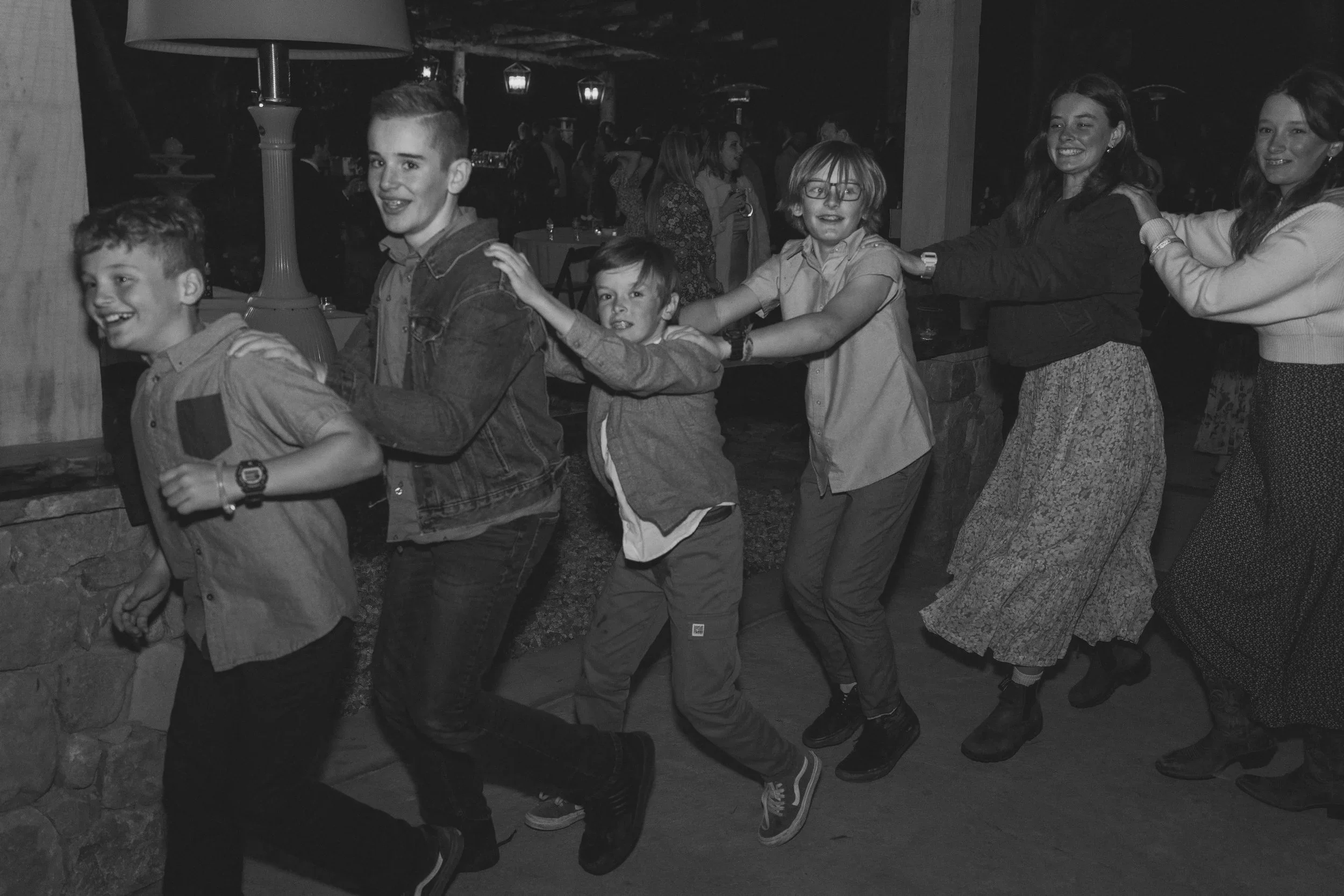 Guests dancing in a circle at wedding reception