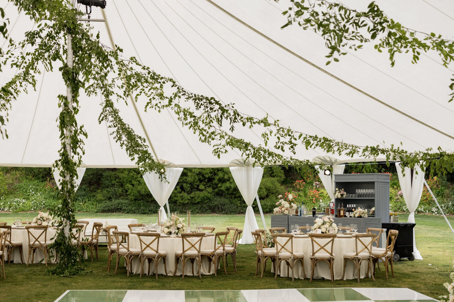 Wedding reception set up under white tent