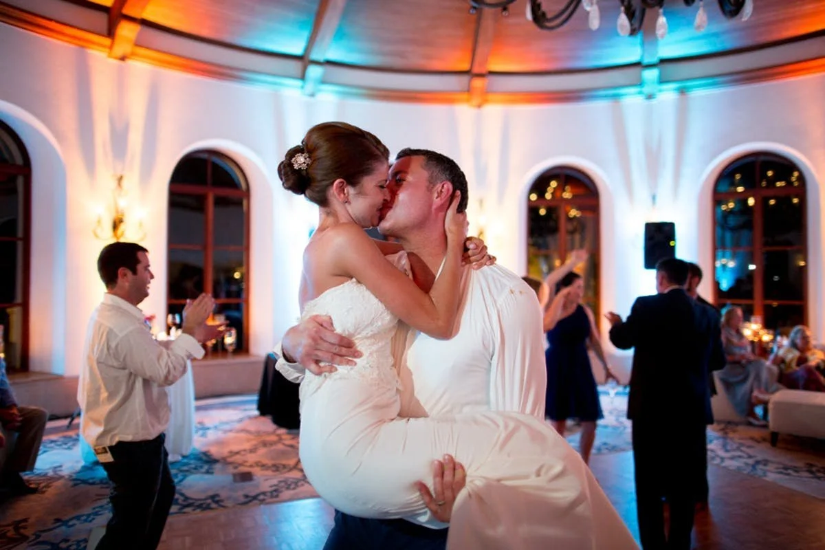Couple kissing on dance floor at Bacara Resort