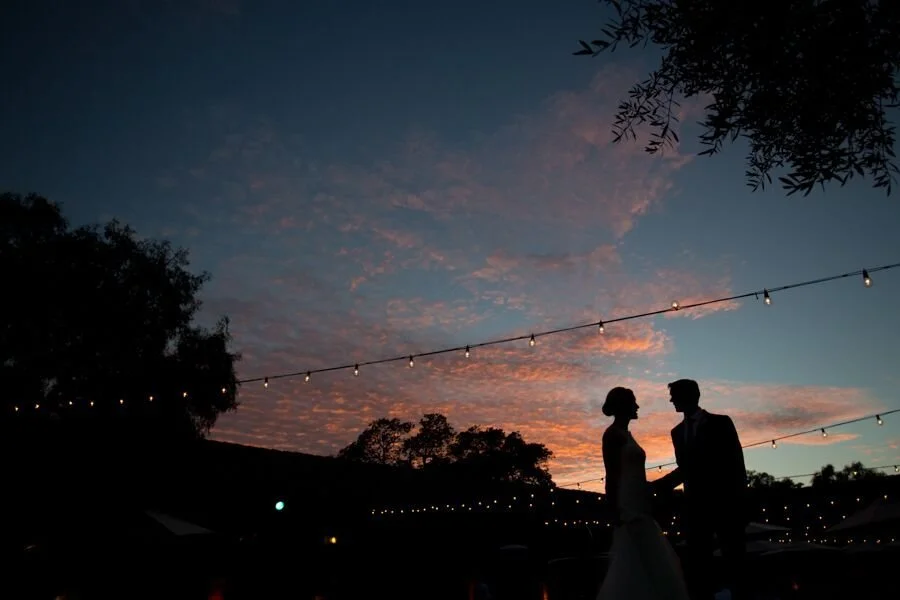 Couple embracing at sunset during Santa Barbara Historical Museum Wedding