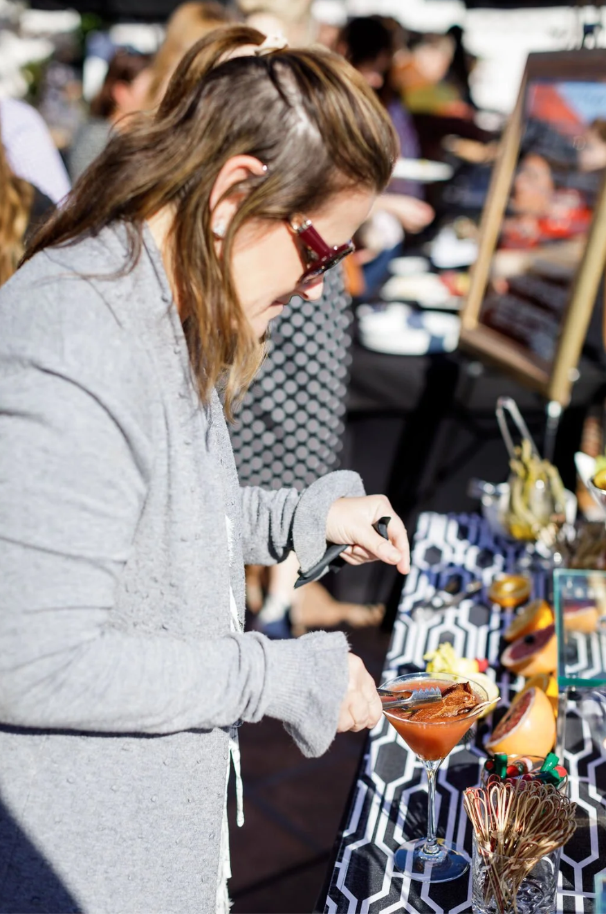 Guest making Bloody Mary at bar