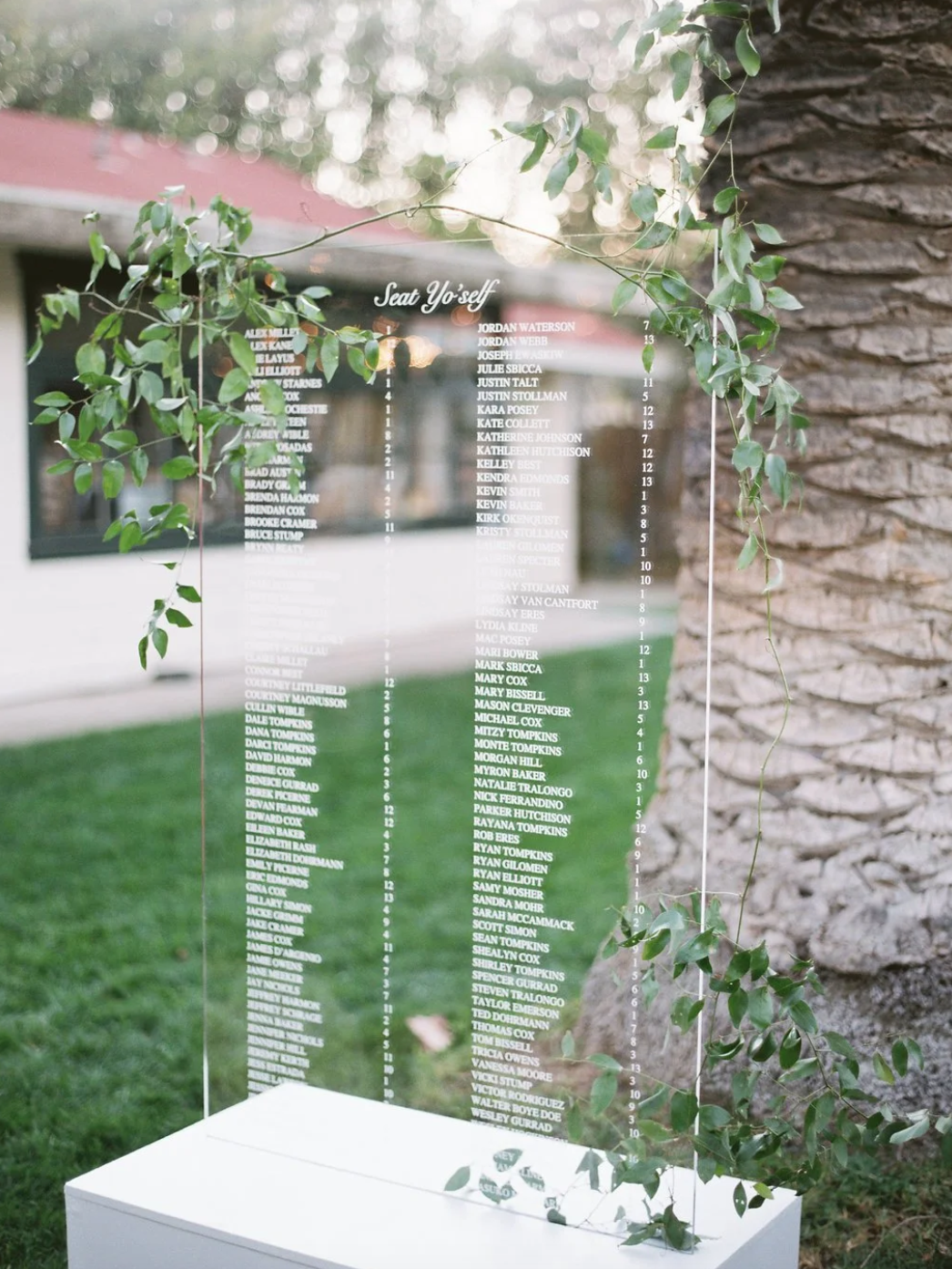 Acrylic seating chart at wedding reception