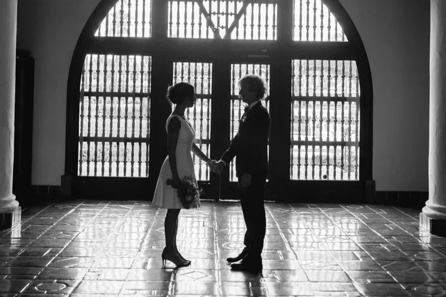 Couple holding hands at Santa Barbara Courthouse elopement