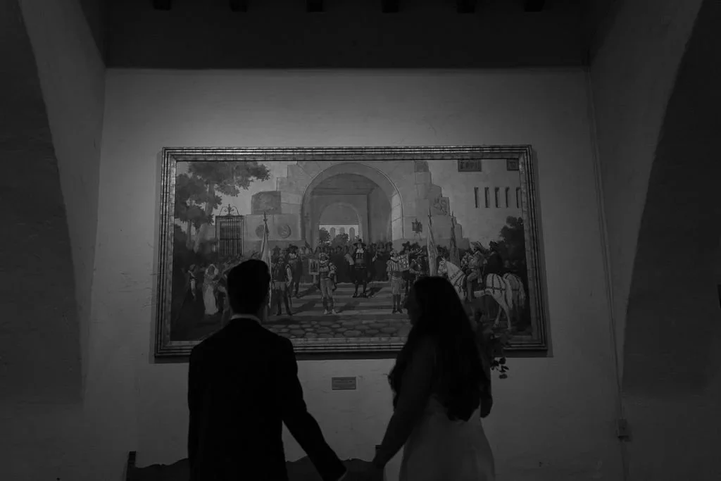 Couple looking at picture at Santa Barbara Courthouse