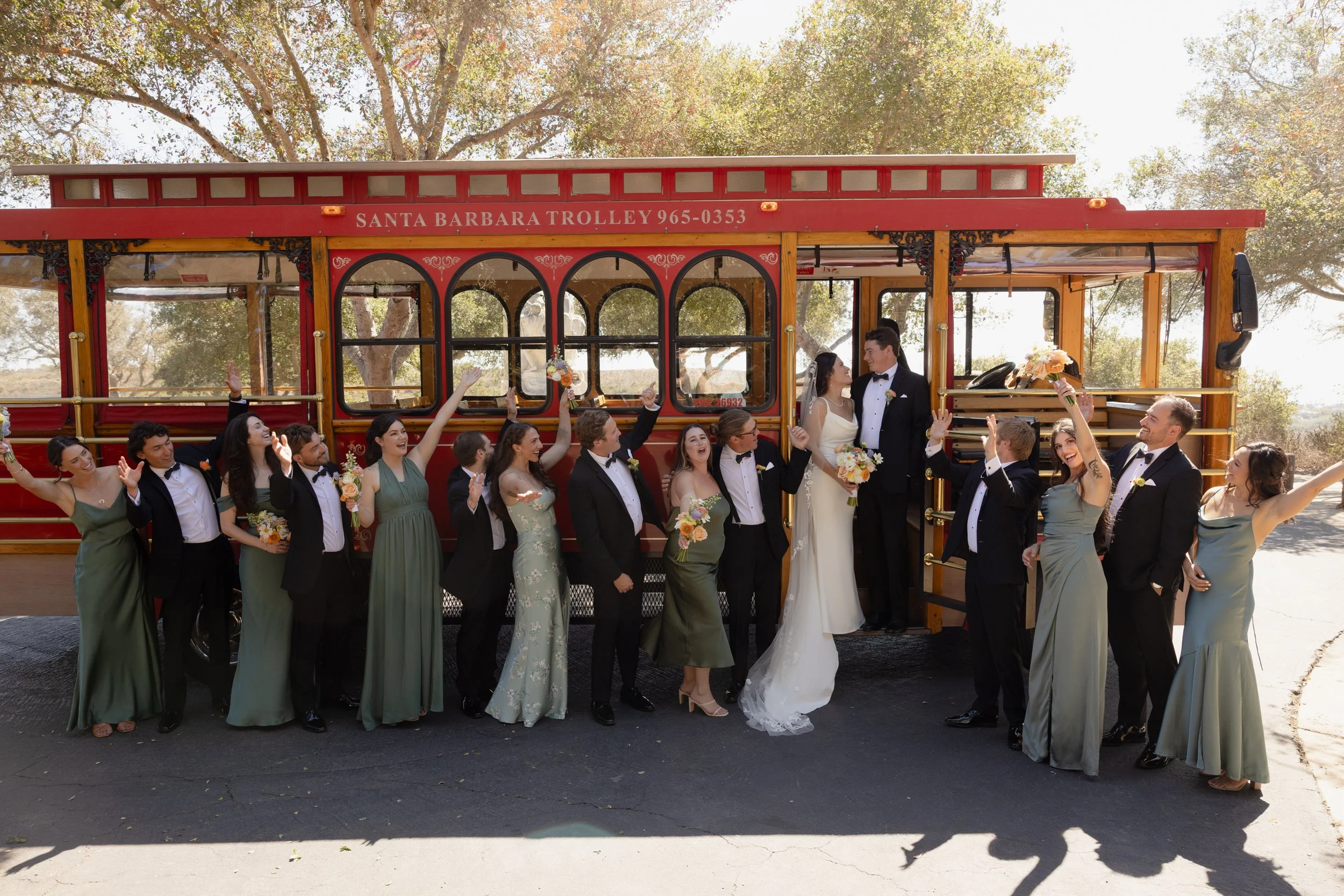 Entire bridal party outside of SB Trolley