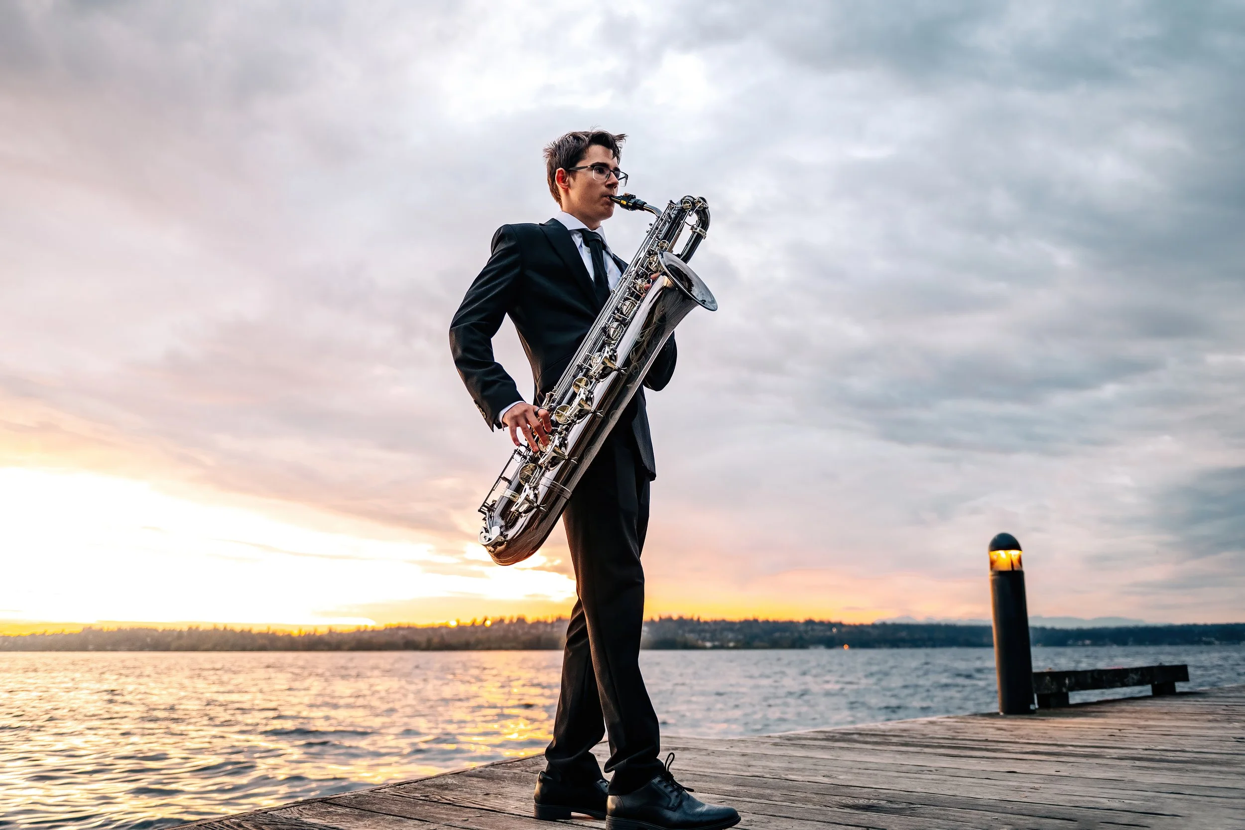 Saxophone being played during senior portraits during photo session at a Kirkland Park