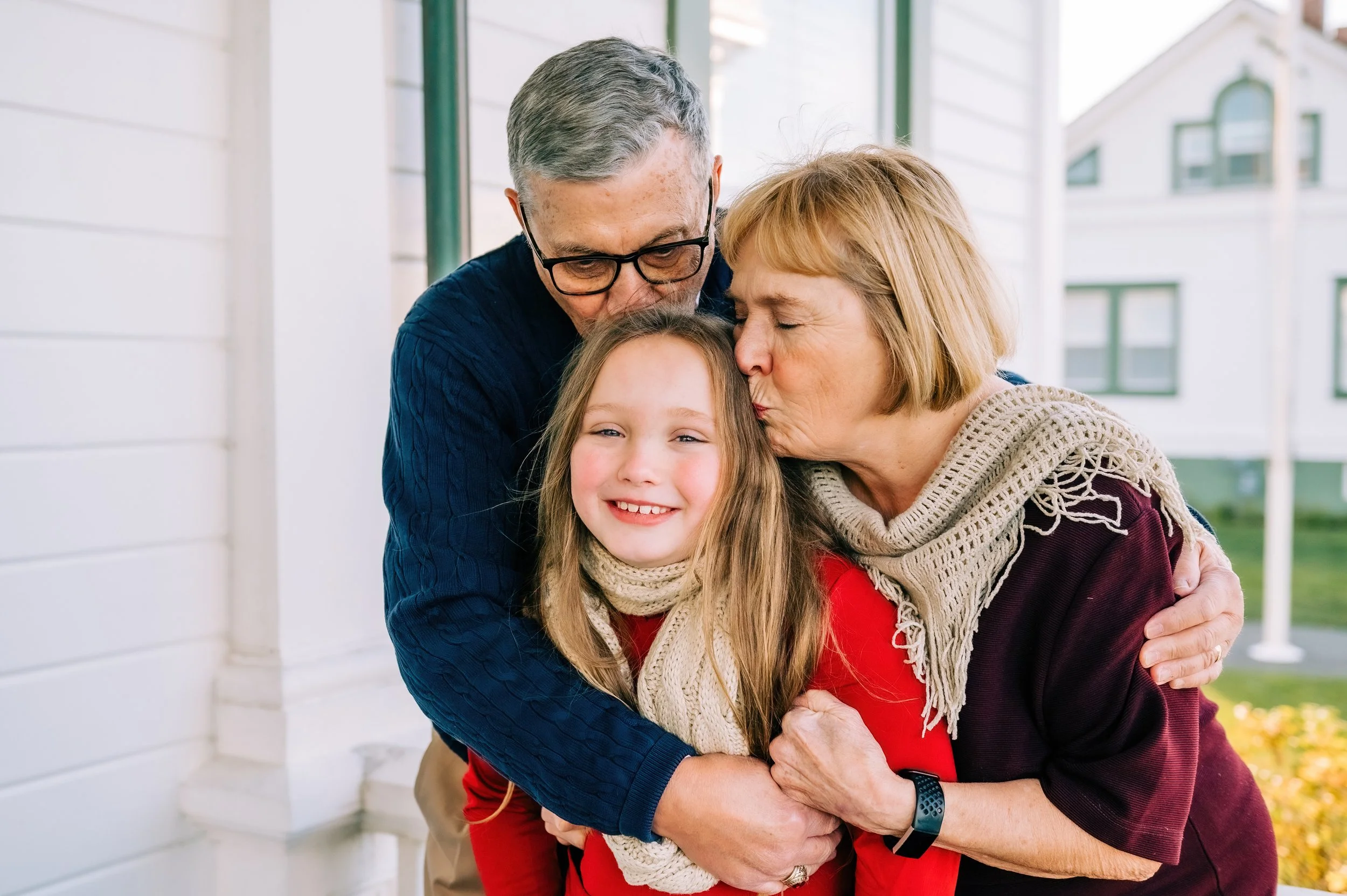 Grandparents and Granddaughter at family photos in the Lighthouse Park in Mukilteo