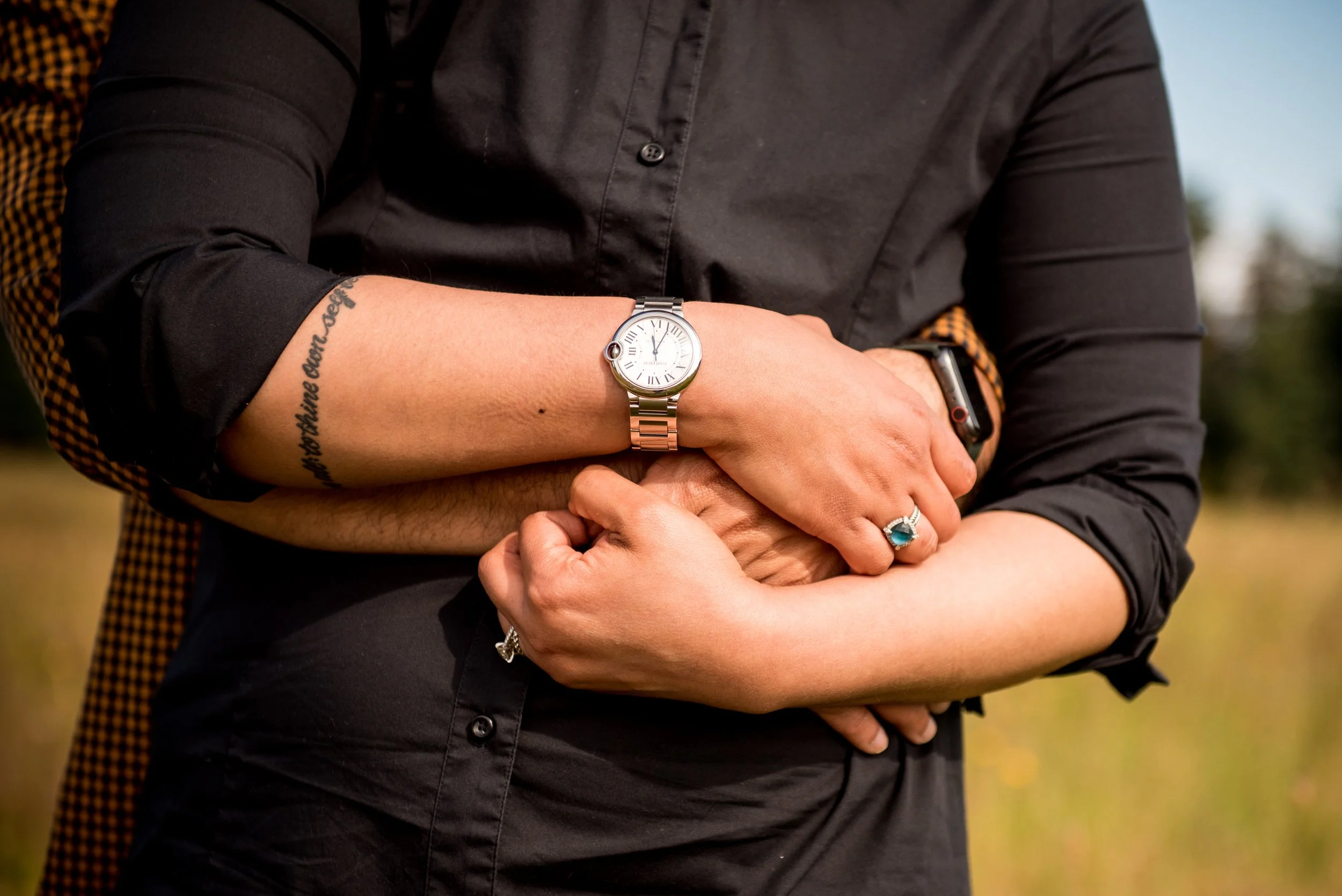 Seattle couple holding hands at Discovery Park
