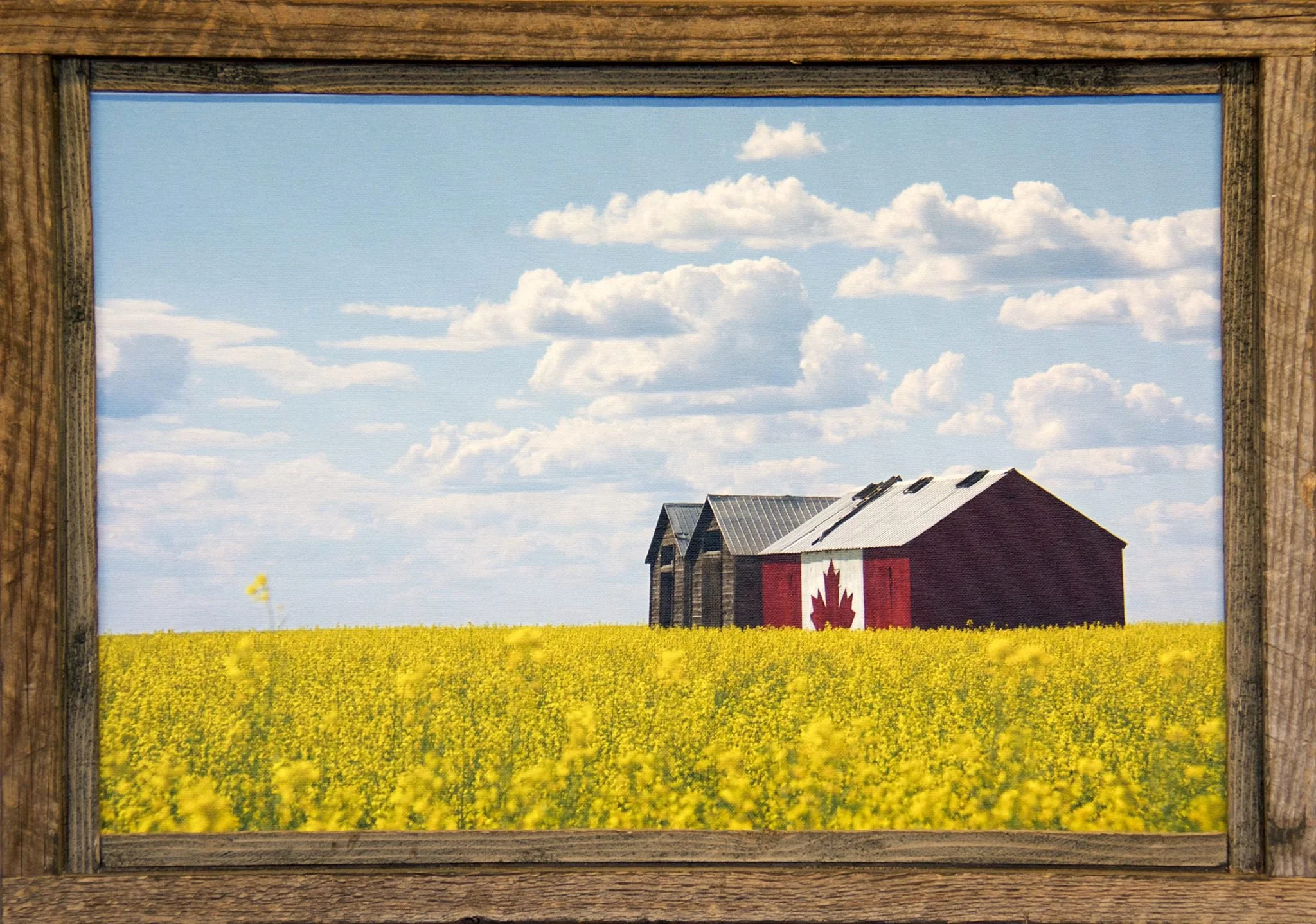 Photo of old granary painted with Canada Flag