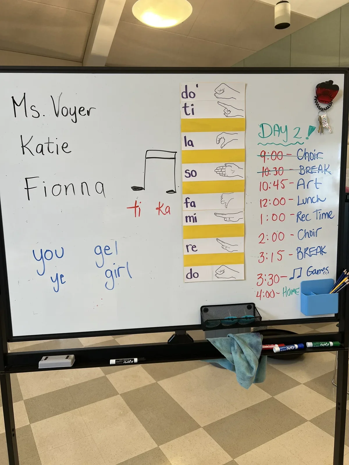 Whiteboard with Kodály solfège hand signs and rhythm syllables used to teach kids music
