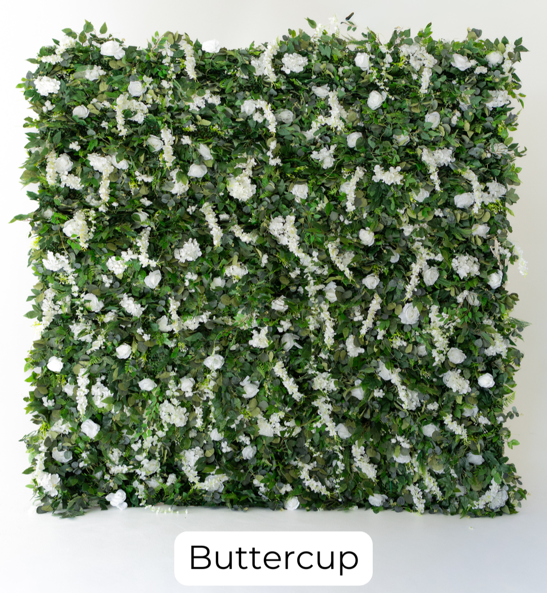 Buttercup is a greenery-rich wall accented with delicate white florals, offering a fresh, garden-inspired feel. The natural contrast makes it a beautiful option for outdoor themes, rustic designs, and organic event styling.