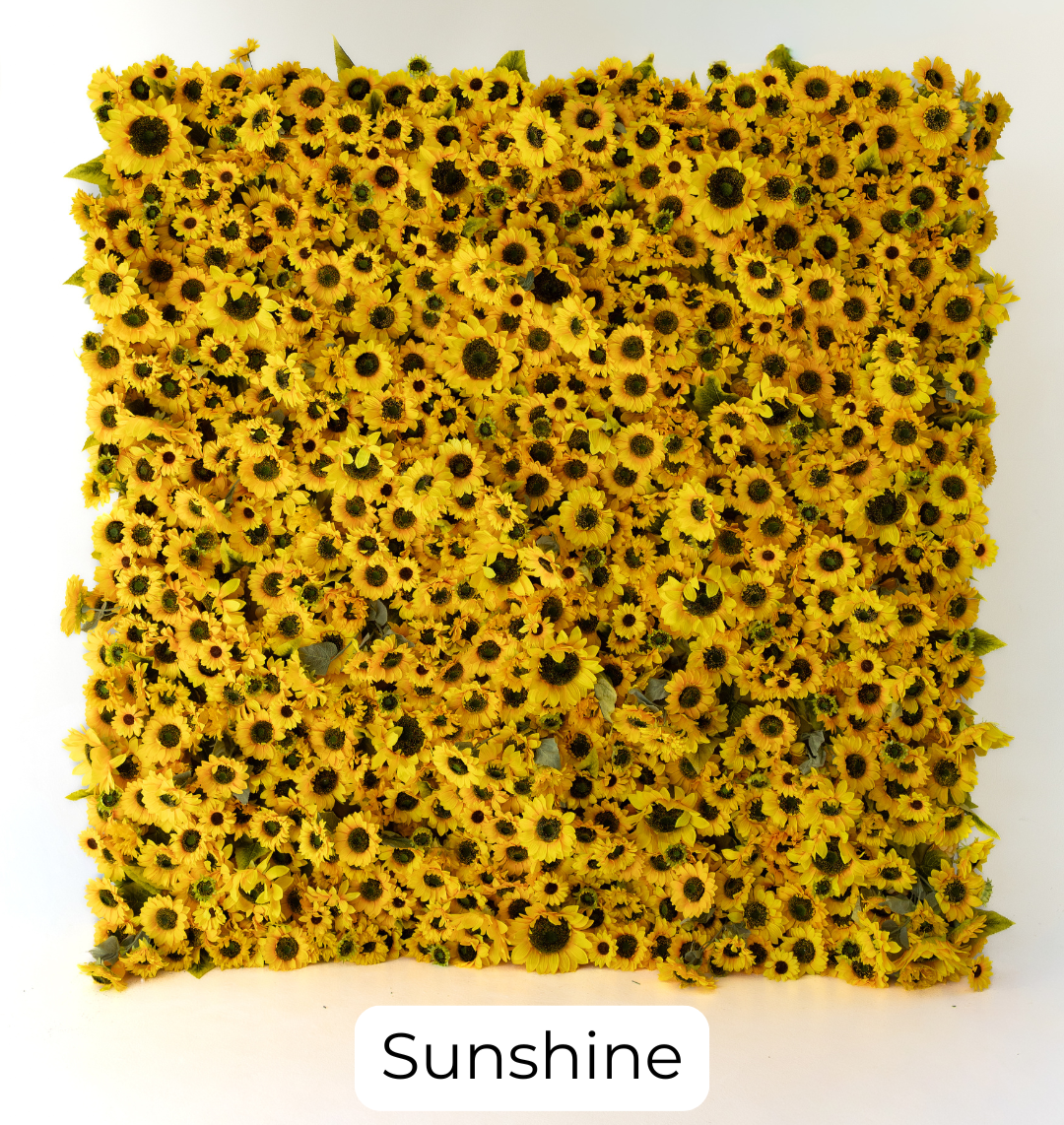 A vibrant arrangement of bright yellow sunflowers layered with rich, natural green foliage. This design creates a cheerful, eye-catching backdrop that instantly adds warmth and energy to any event.