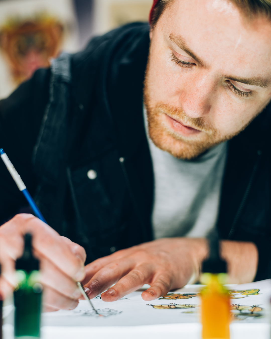 Artist drawing tattoo design ideas to practice linework, composition, and tattoo-ready artwork.