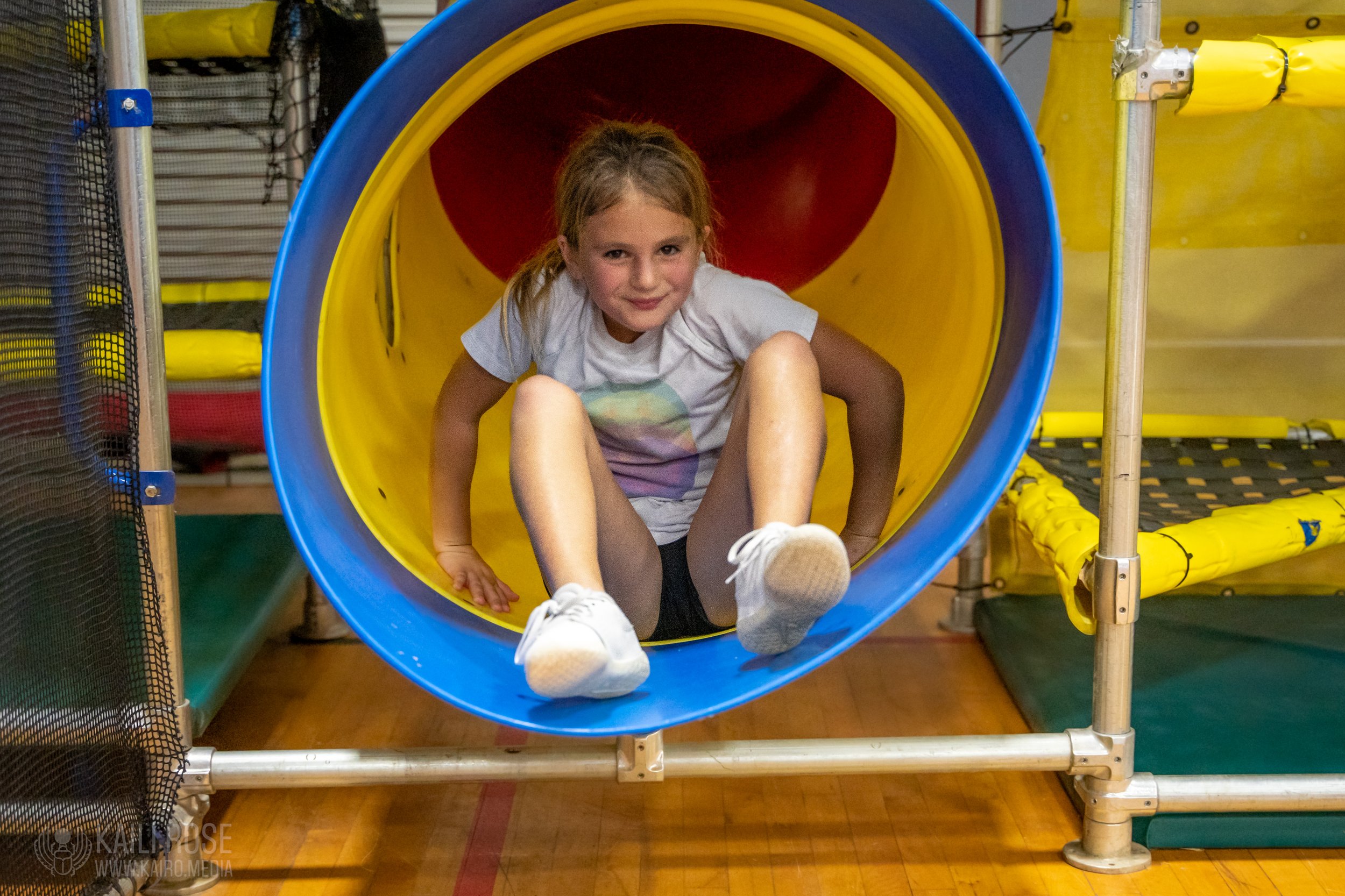 youth play slide at the fun factory