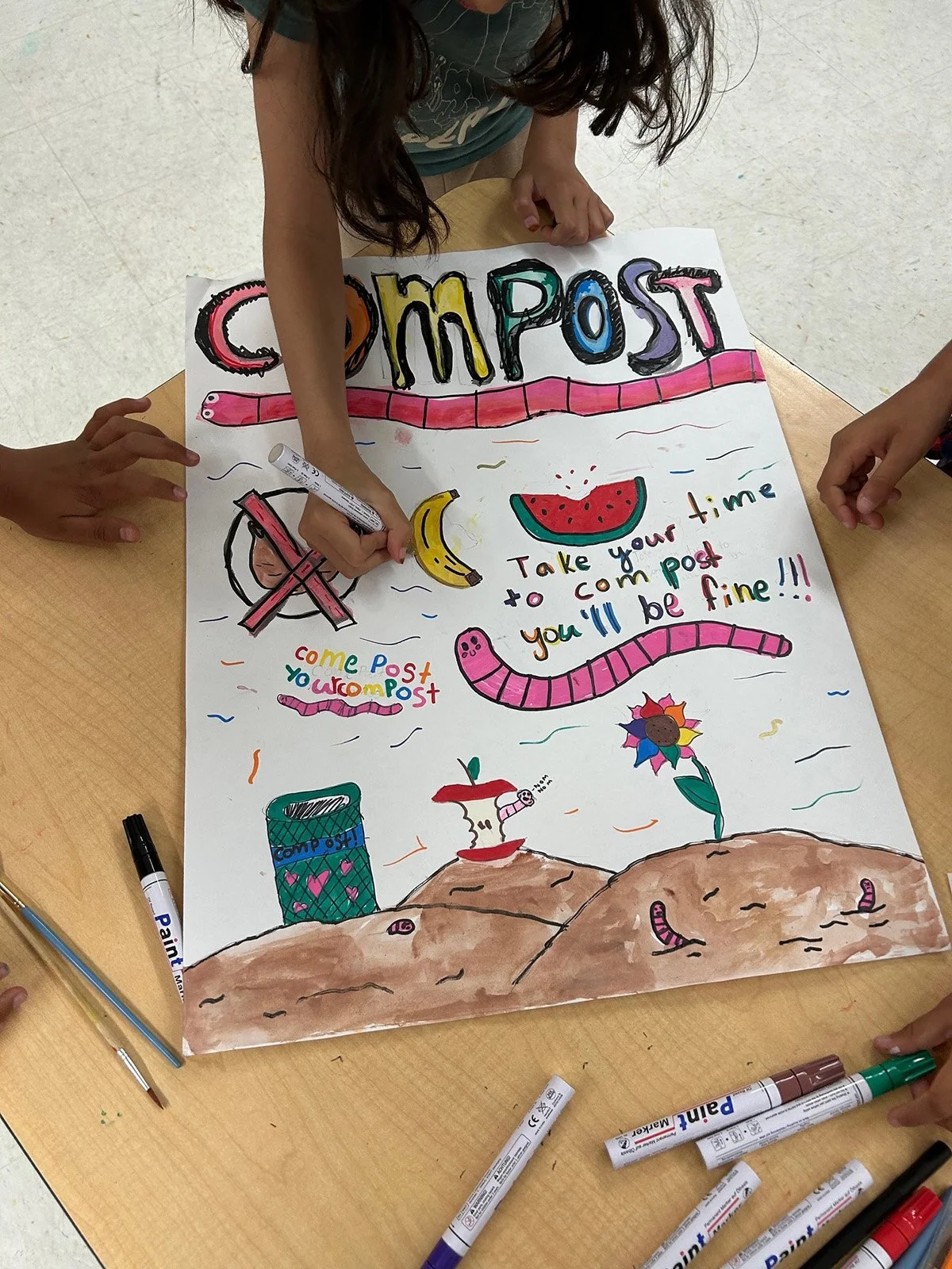 Marin City_Summer 2025_Girl hand with poster.jpeg