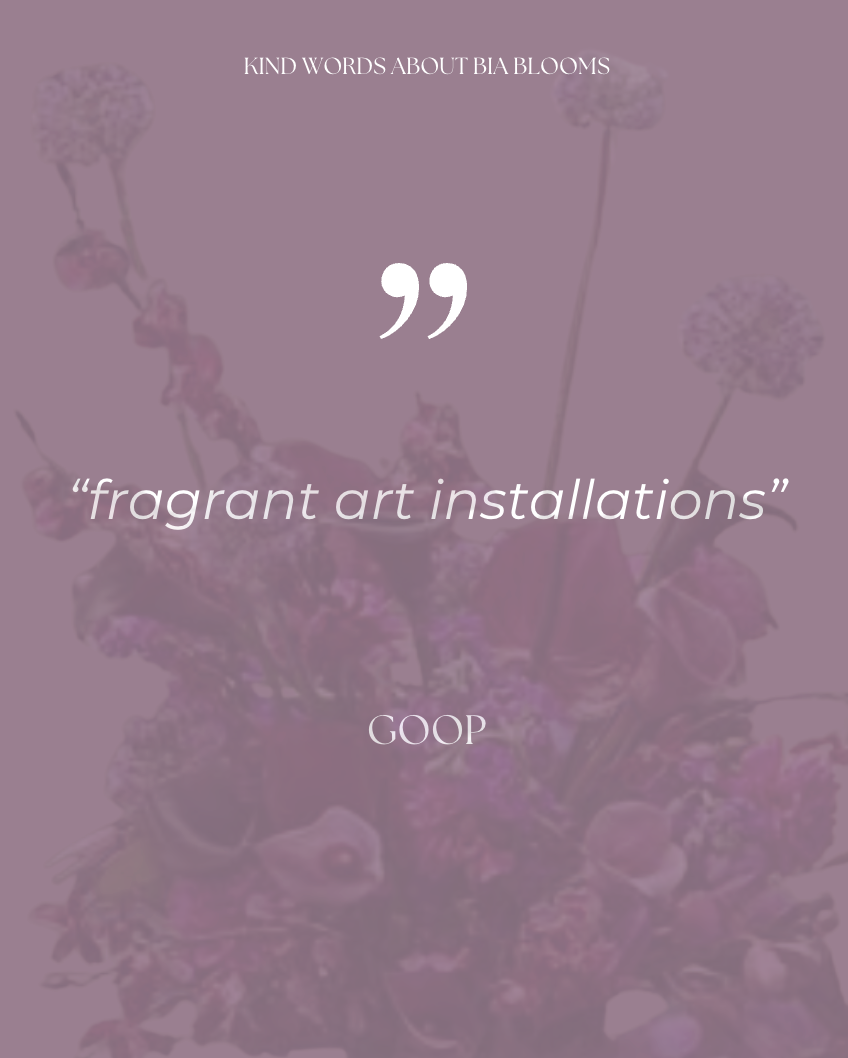 A purple background with a floral arrangement of pink and purple flowers. Overlaid is a quote in white text that says, "fragrant art installations" from GOOP, with a header at the top that reads, "KIND WORDS ABOUT BIA BLOOMS."