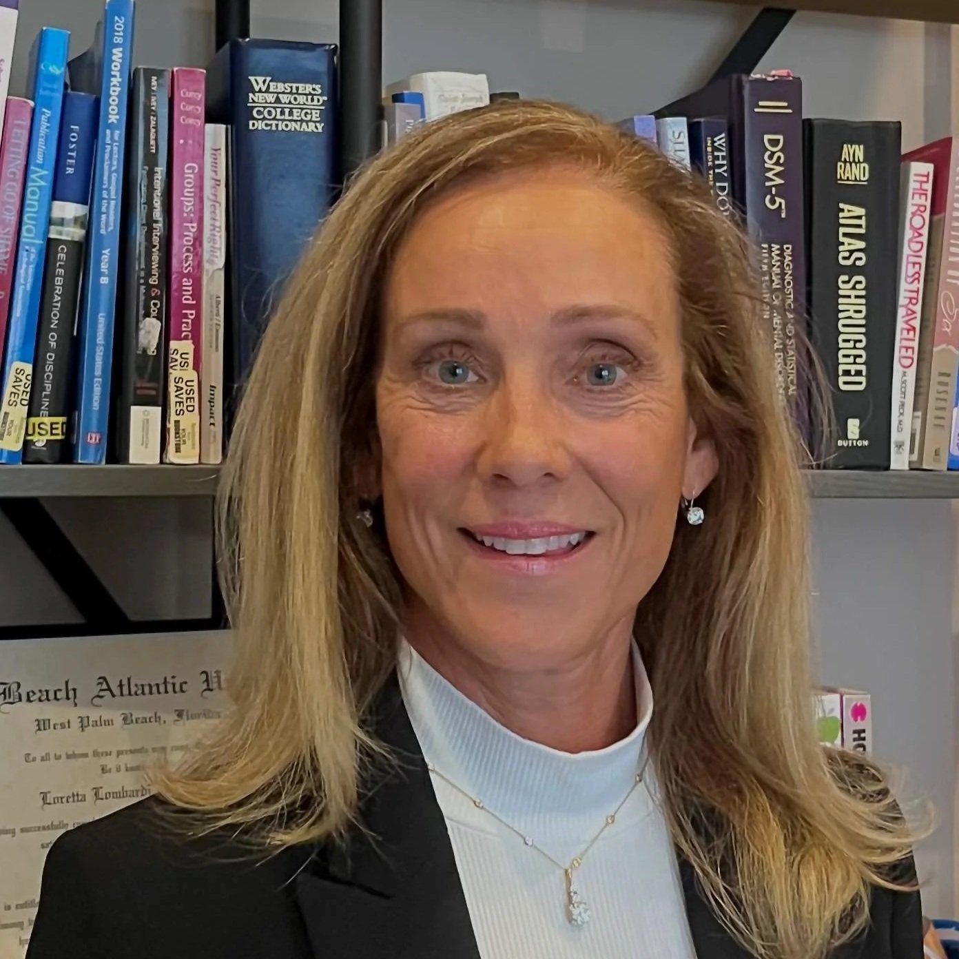 Loretta Lombardi, LMHC, Licensed Mental Health Counselor specializing in Women’s Trauma and EMDR therapy.