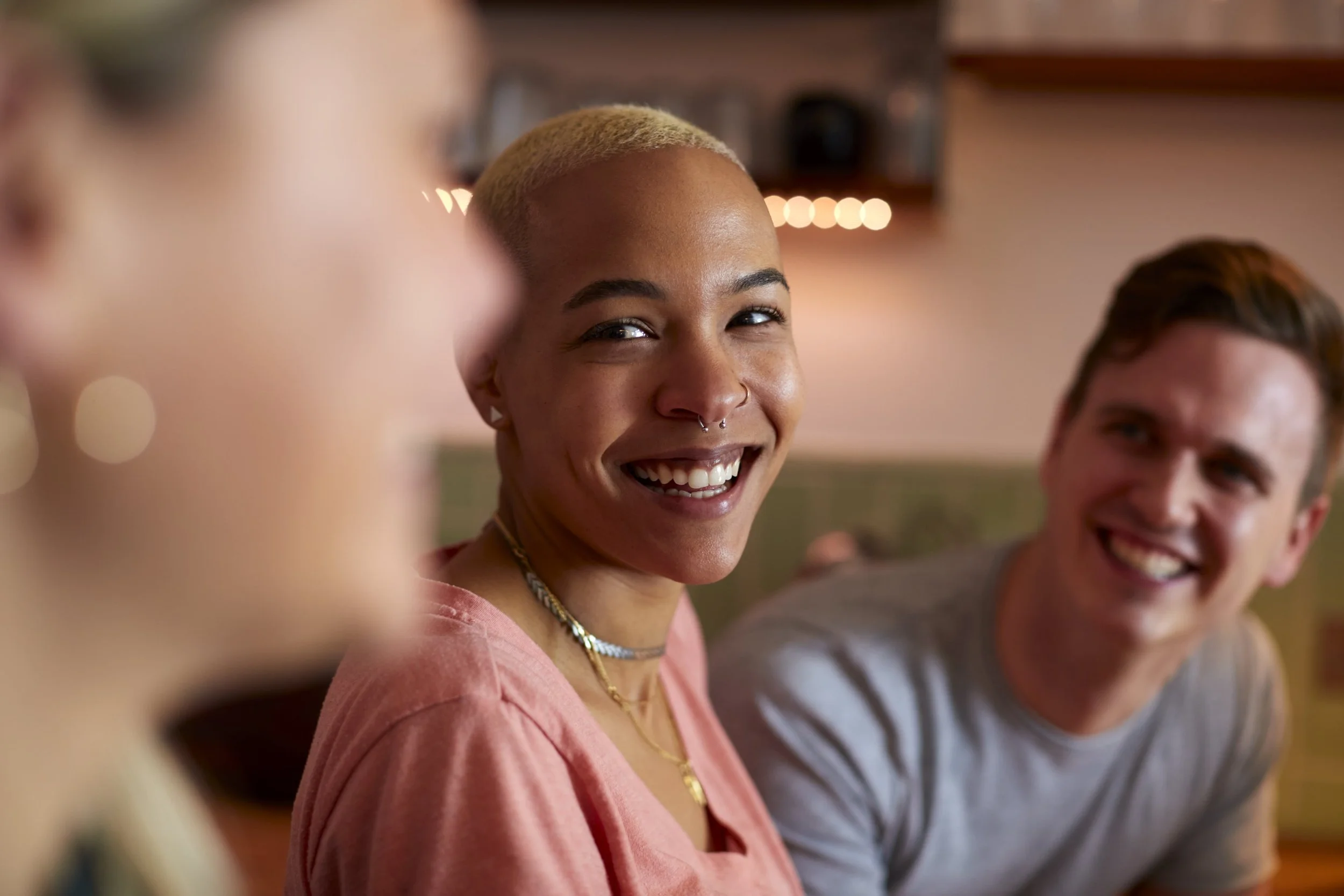 A smiling woman representing the confidence and calm achieved through virtual anxiety therapy at Everthrive Counseling in New Port Richey.