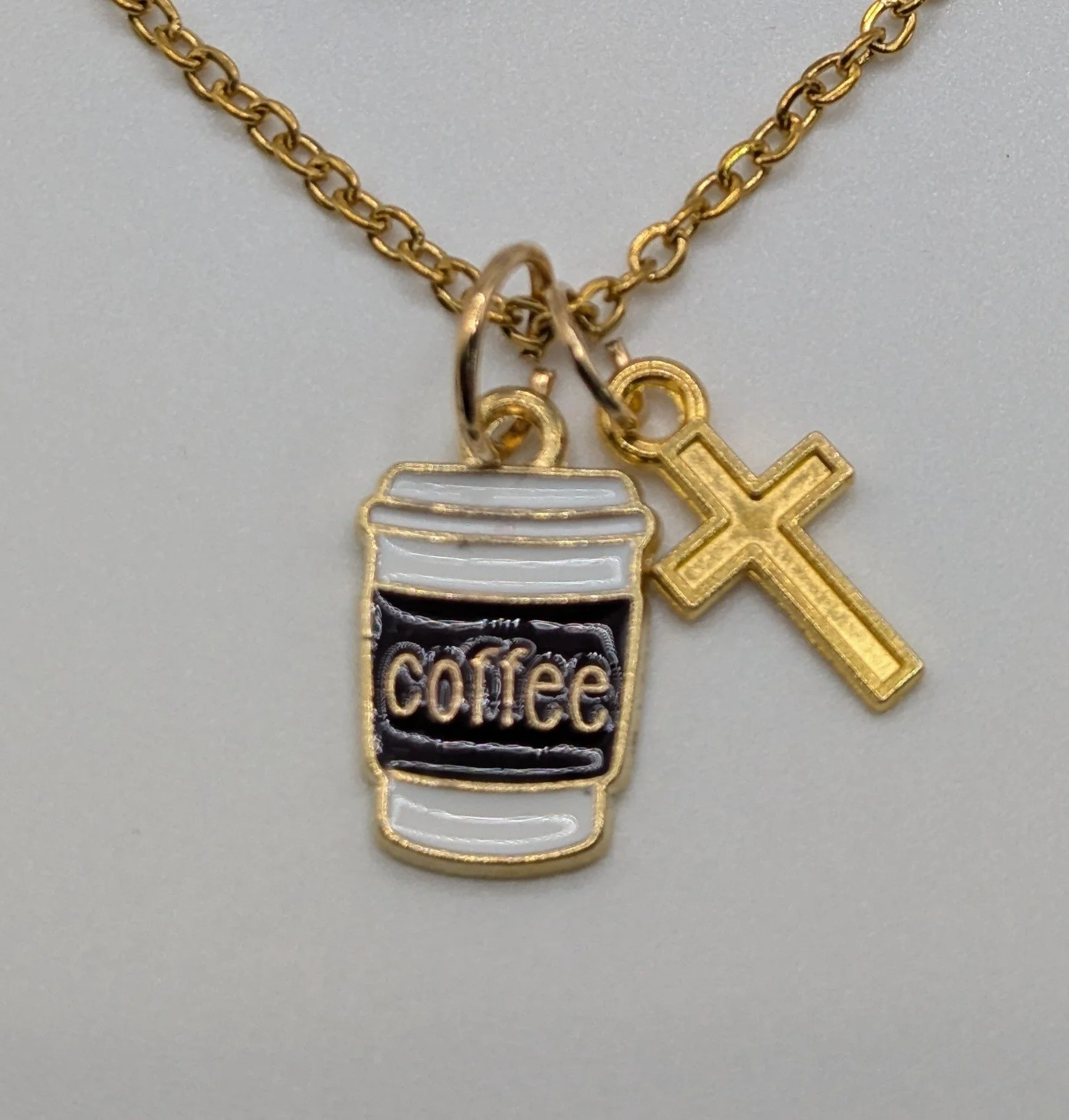 coffee and Jesus gold pendants on necklace.jpg